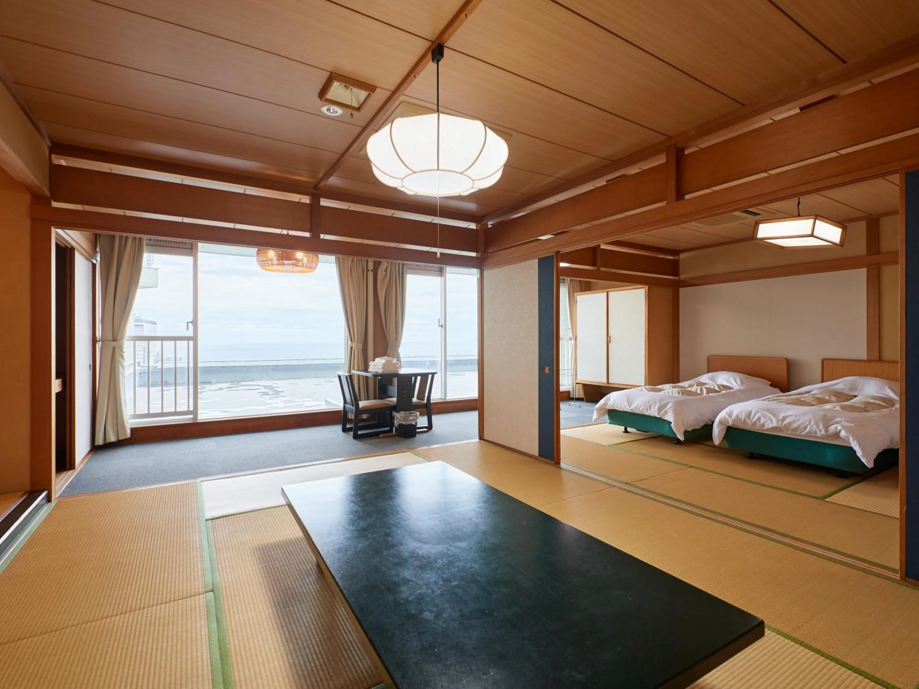 Bed in Izu Atagawa Onsen Hotel Gyokuryu