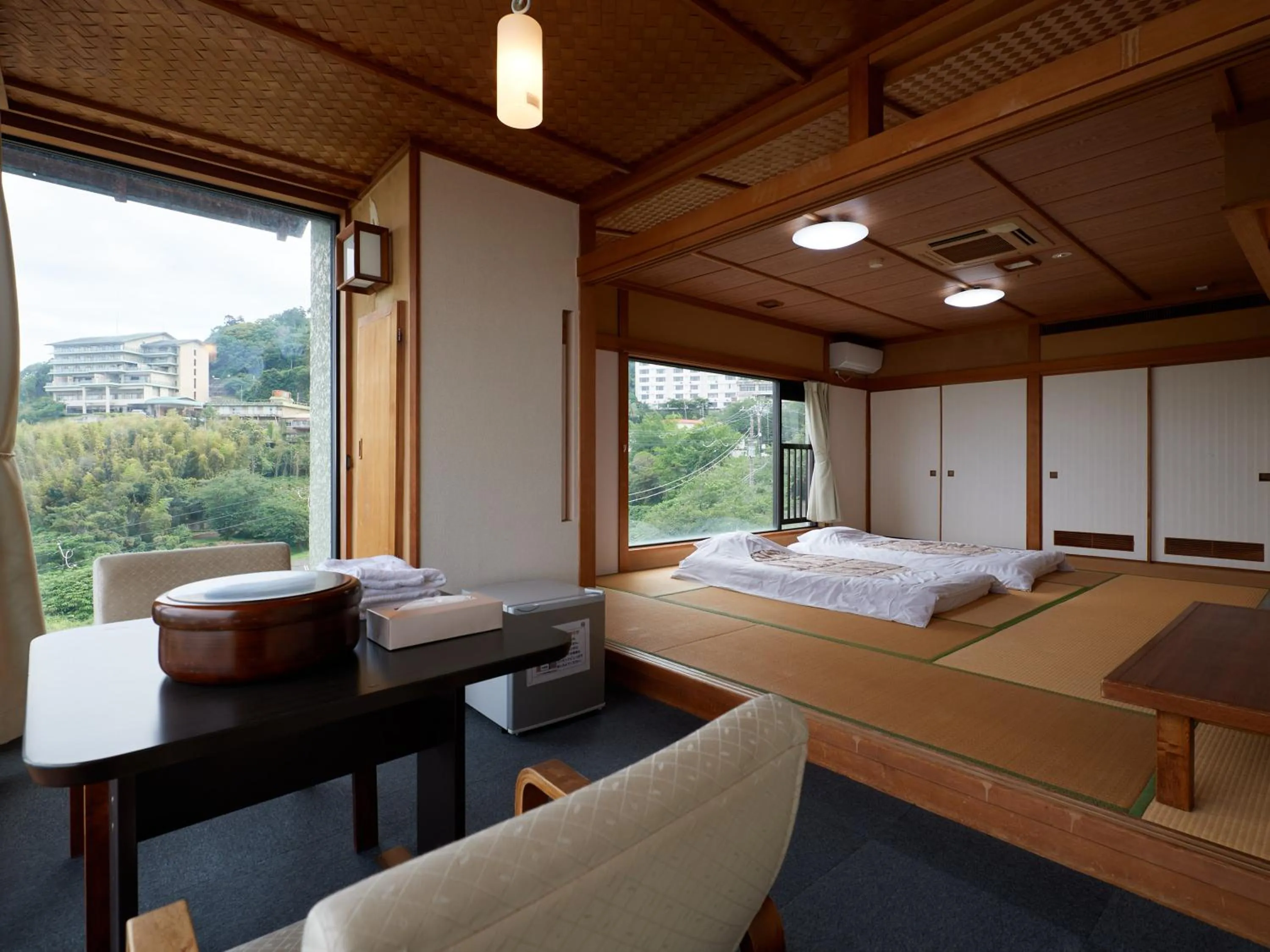 Bed in Izu Atagawa Onsen Hotel Gyokuryu