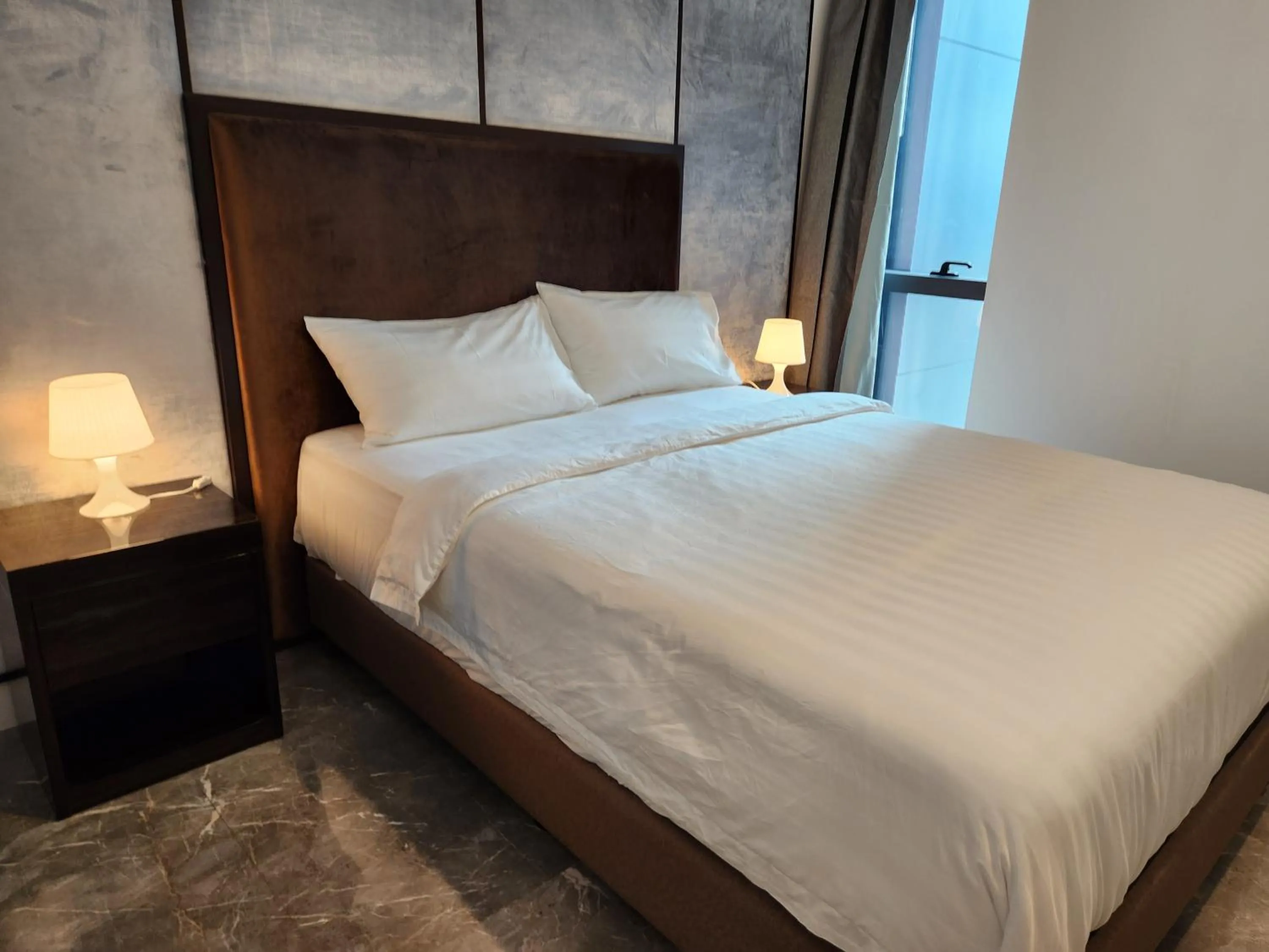 Bed in The Platinum 2 Premium Suite by Reluxe
