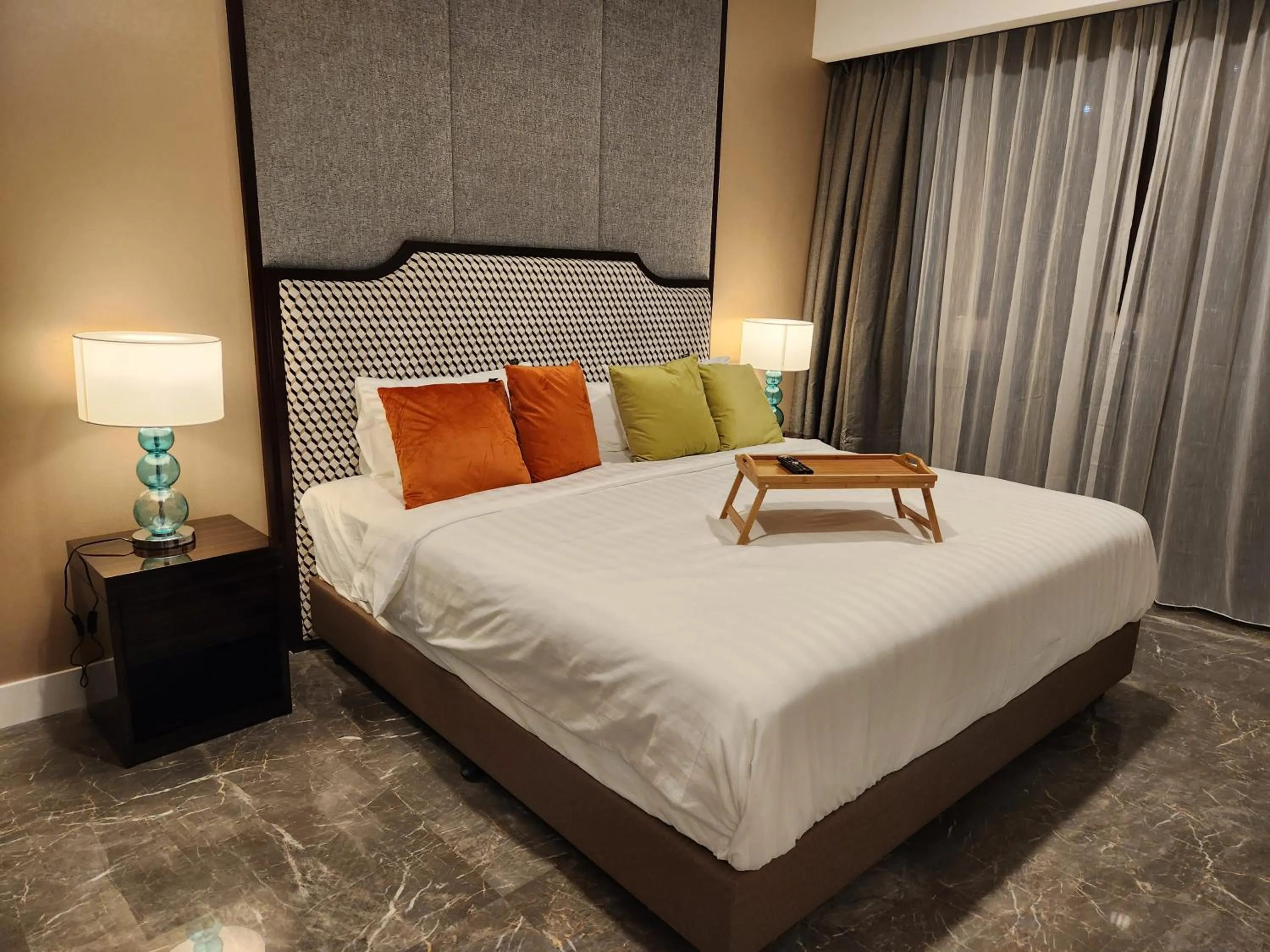 Bed in The Platinum 2 Premium Suite by Reluxe