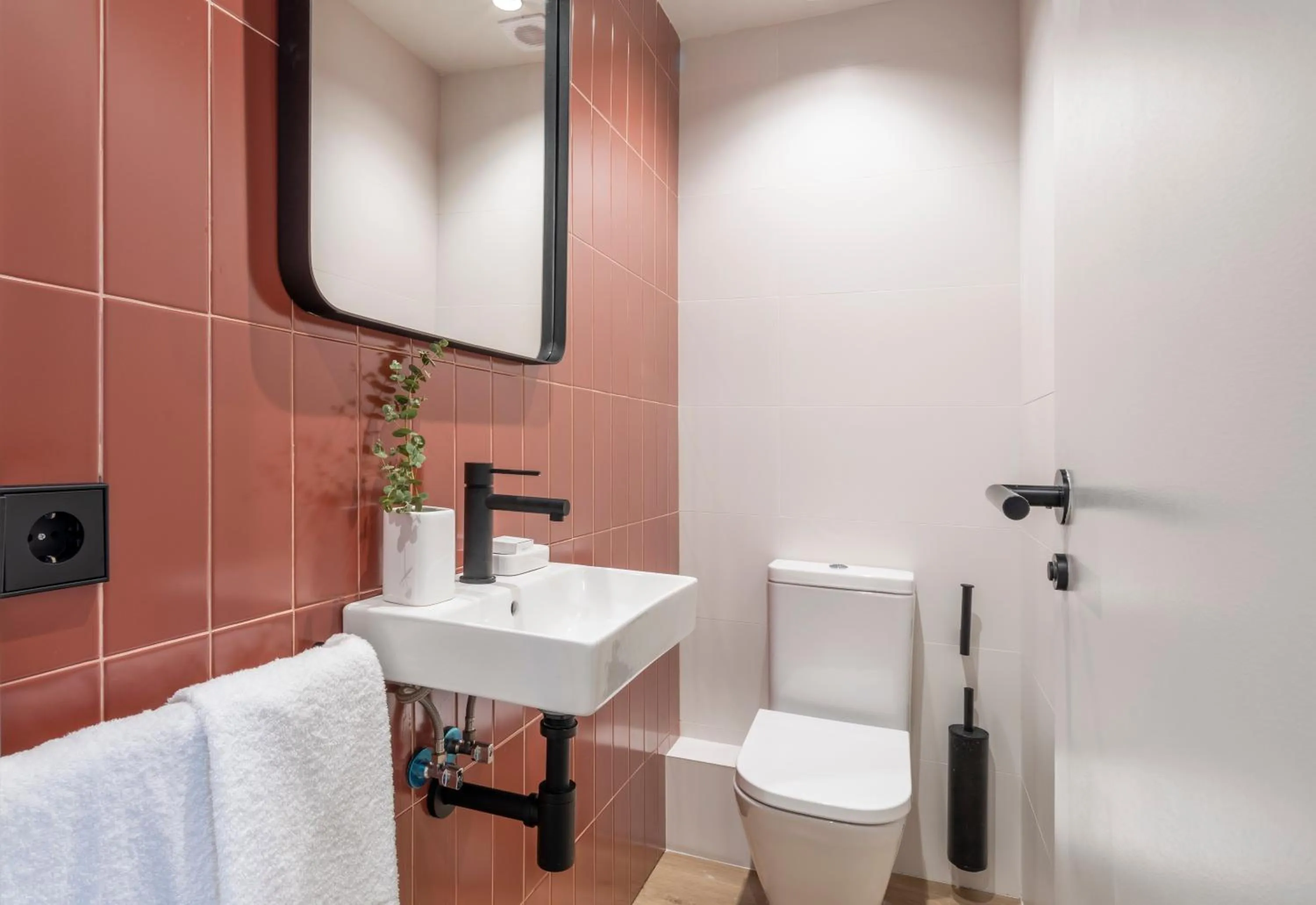 Toilet in Arrivo Apartments