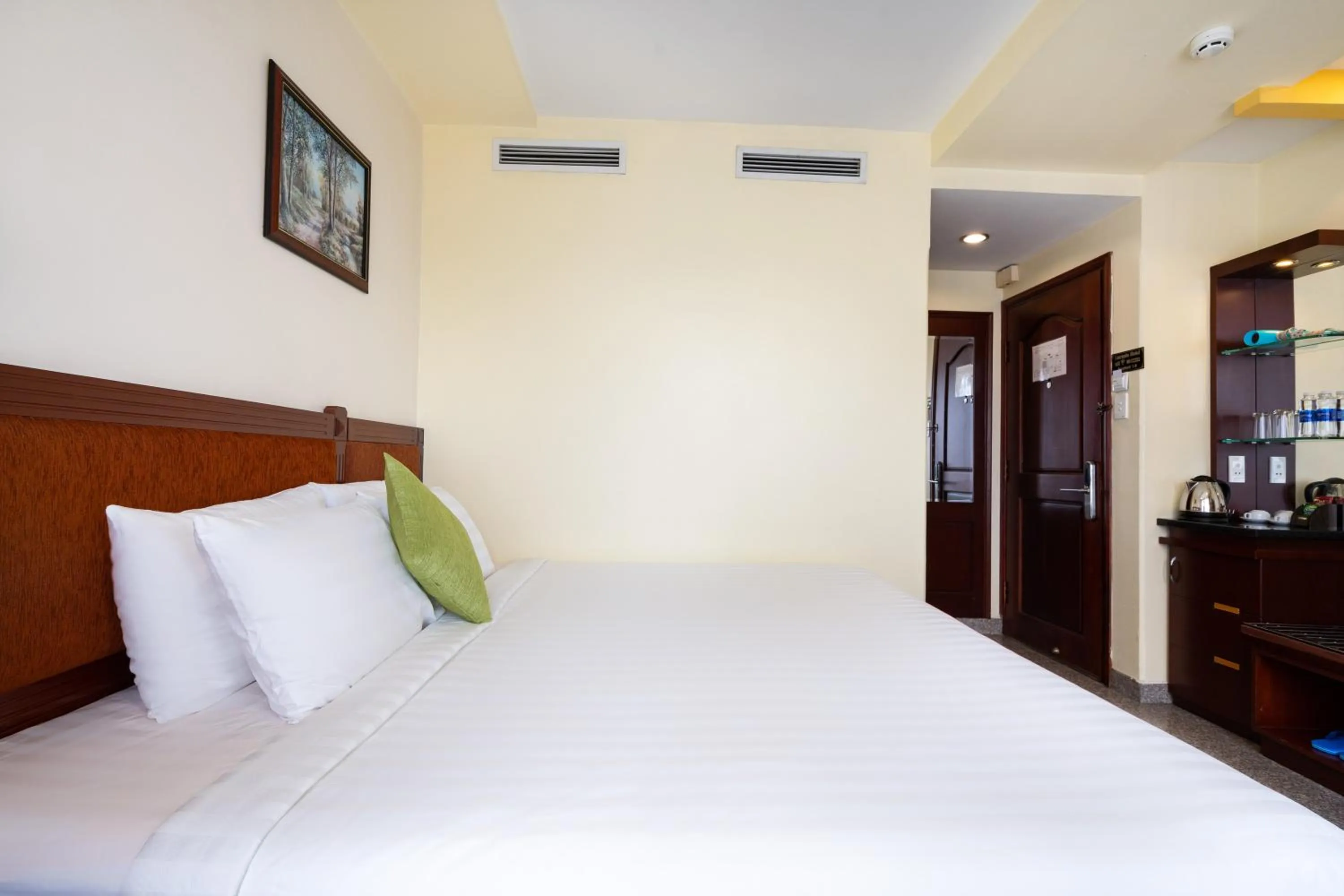 Bed in LUCASTA SAIGON Hotel