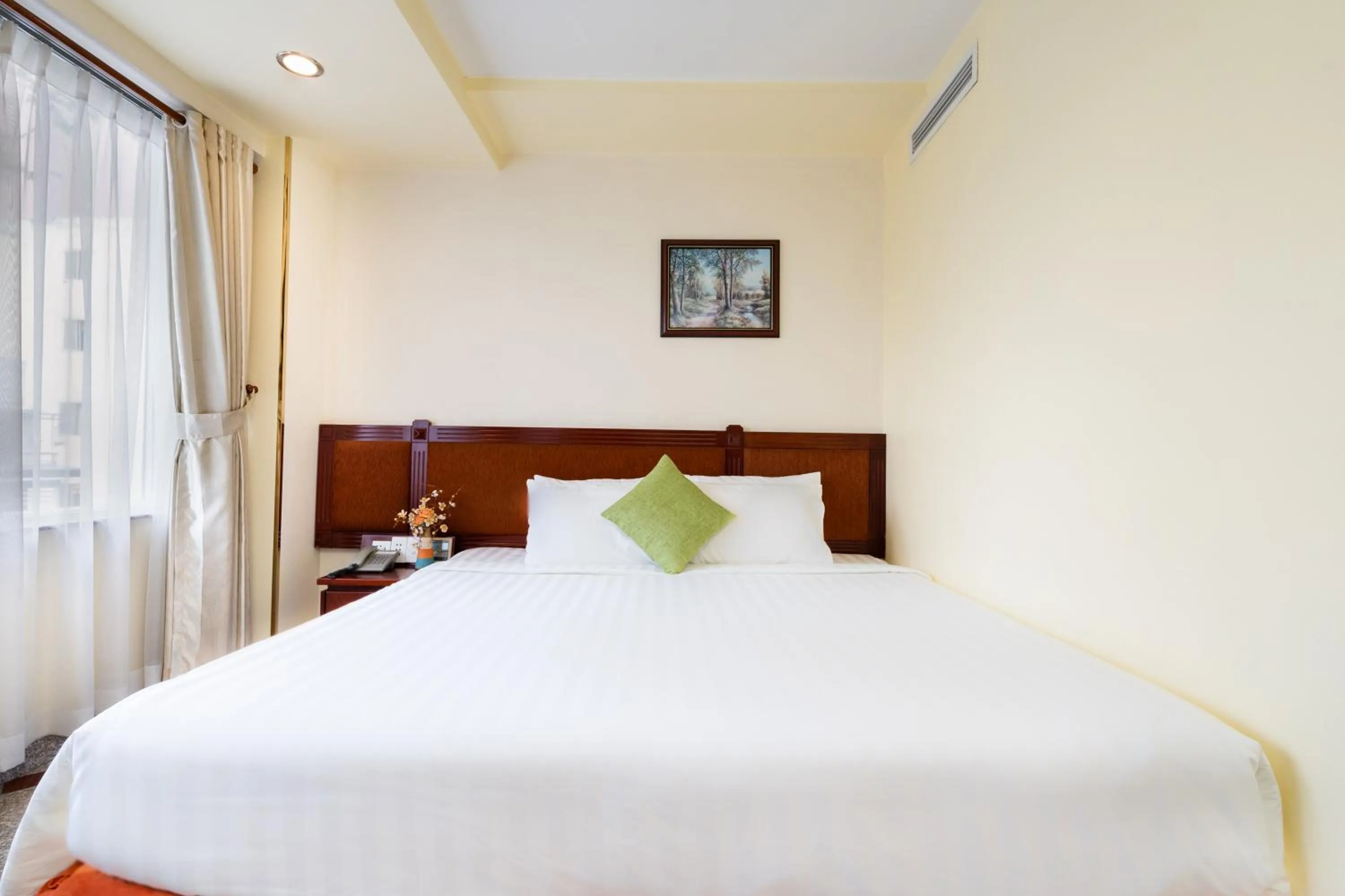 Bed in LUCASTA SAIGON Hotel