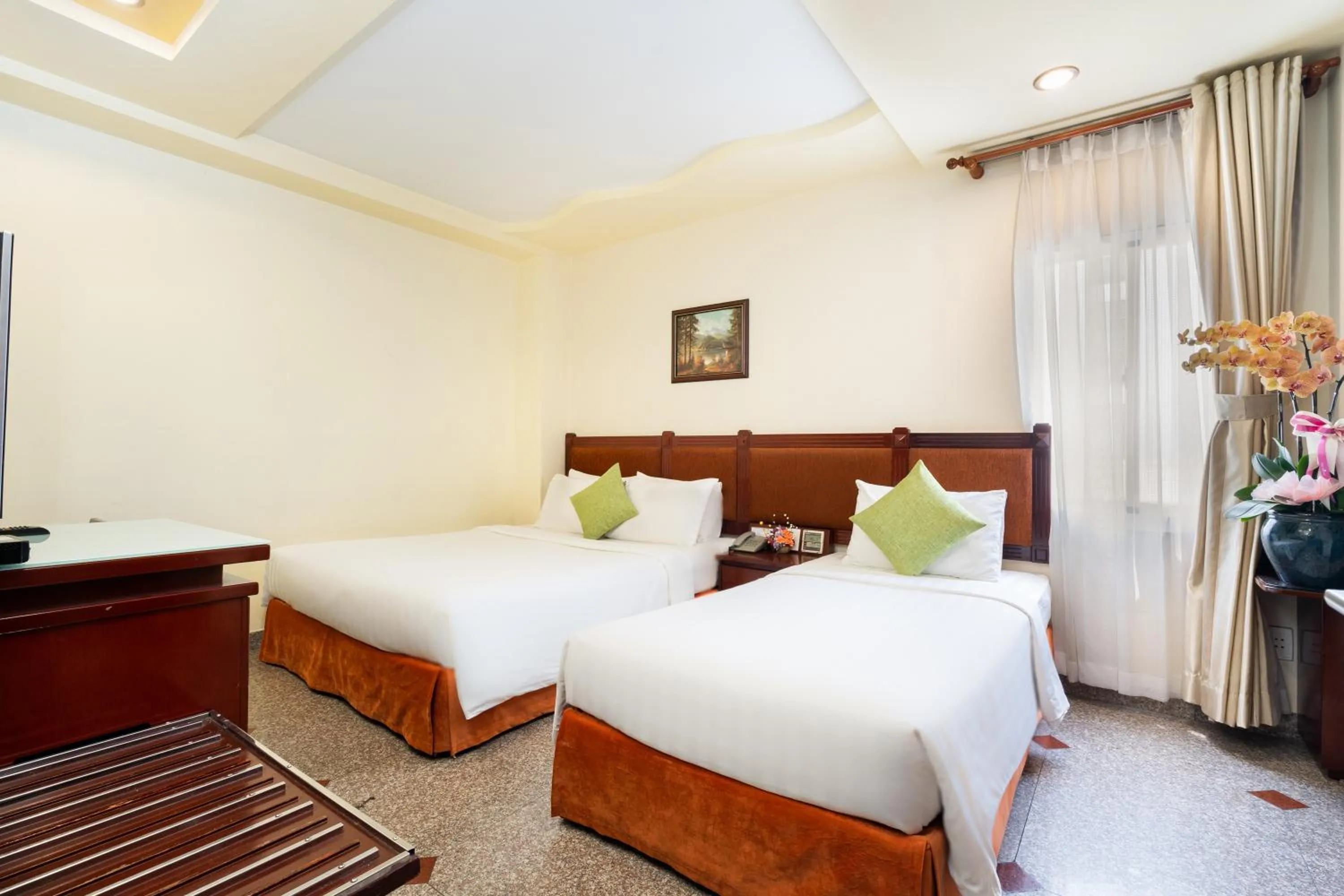 Bed in LUCASTA SAIGON Hotel