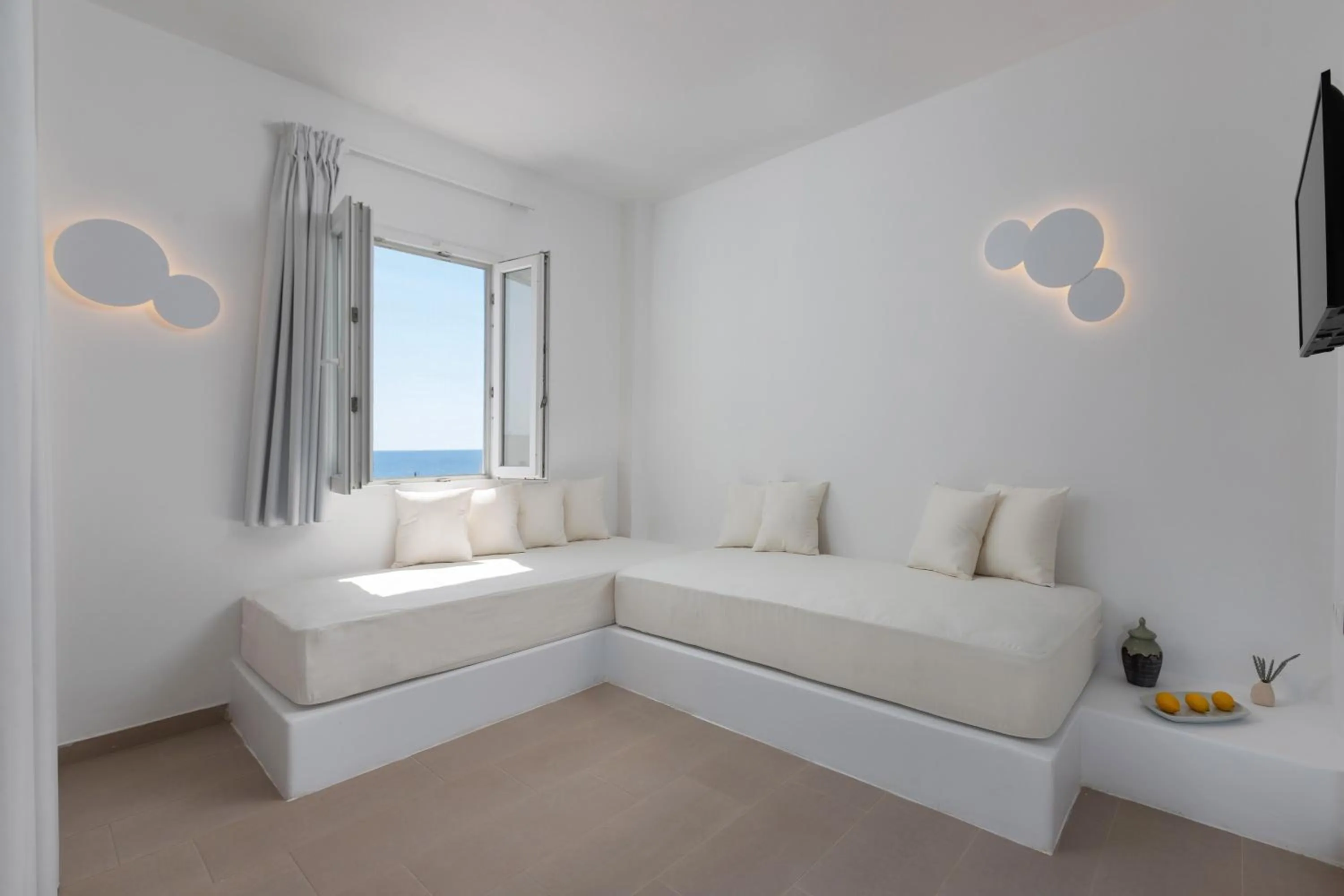 Bed in VOCA HOTEL & SUITES