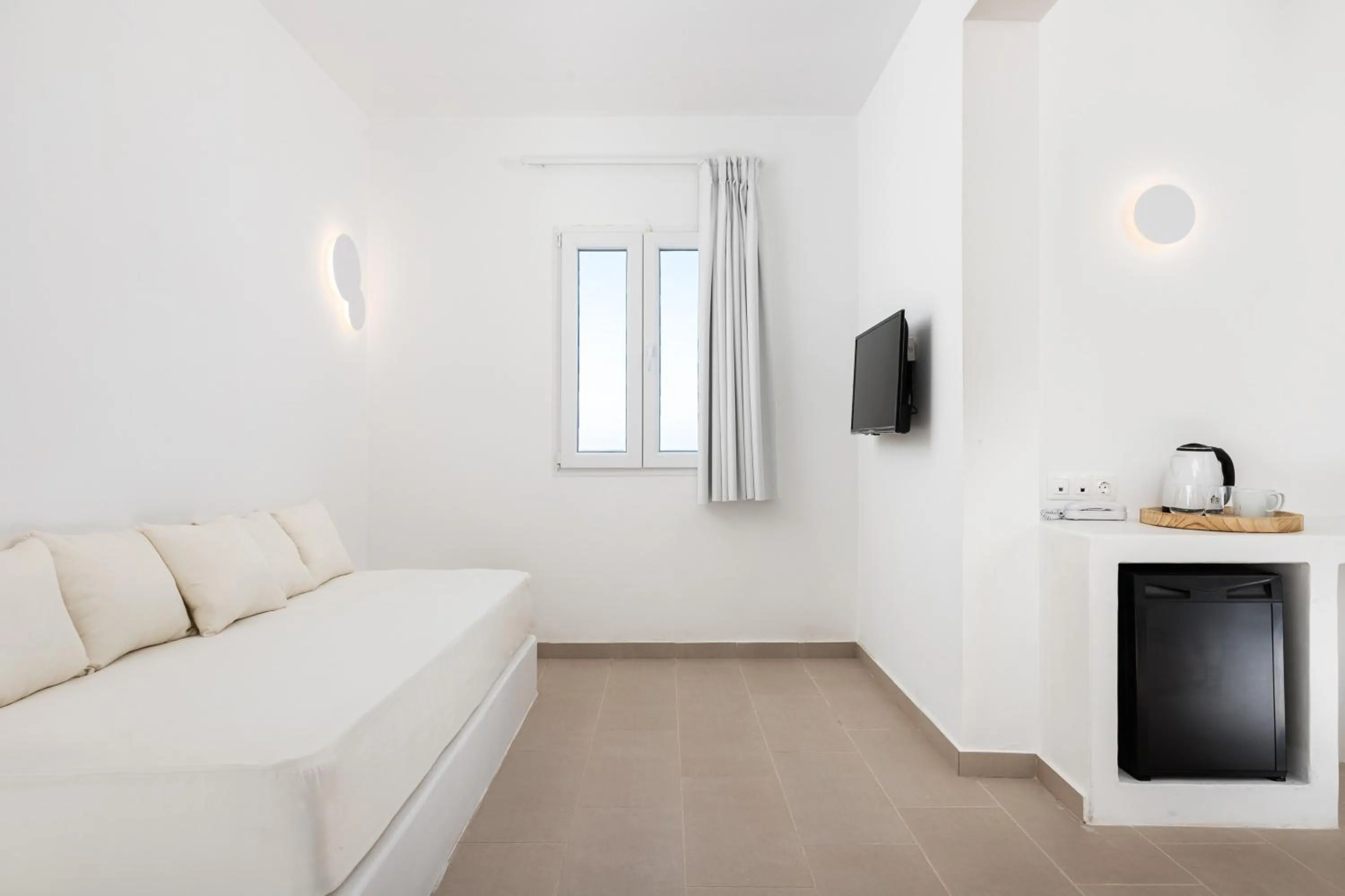 Bed in VOCA HOTEL & SUITES