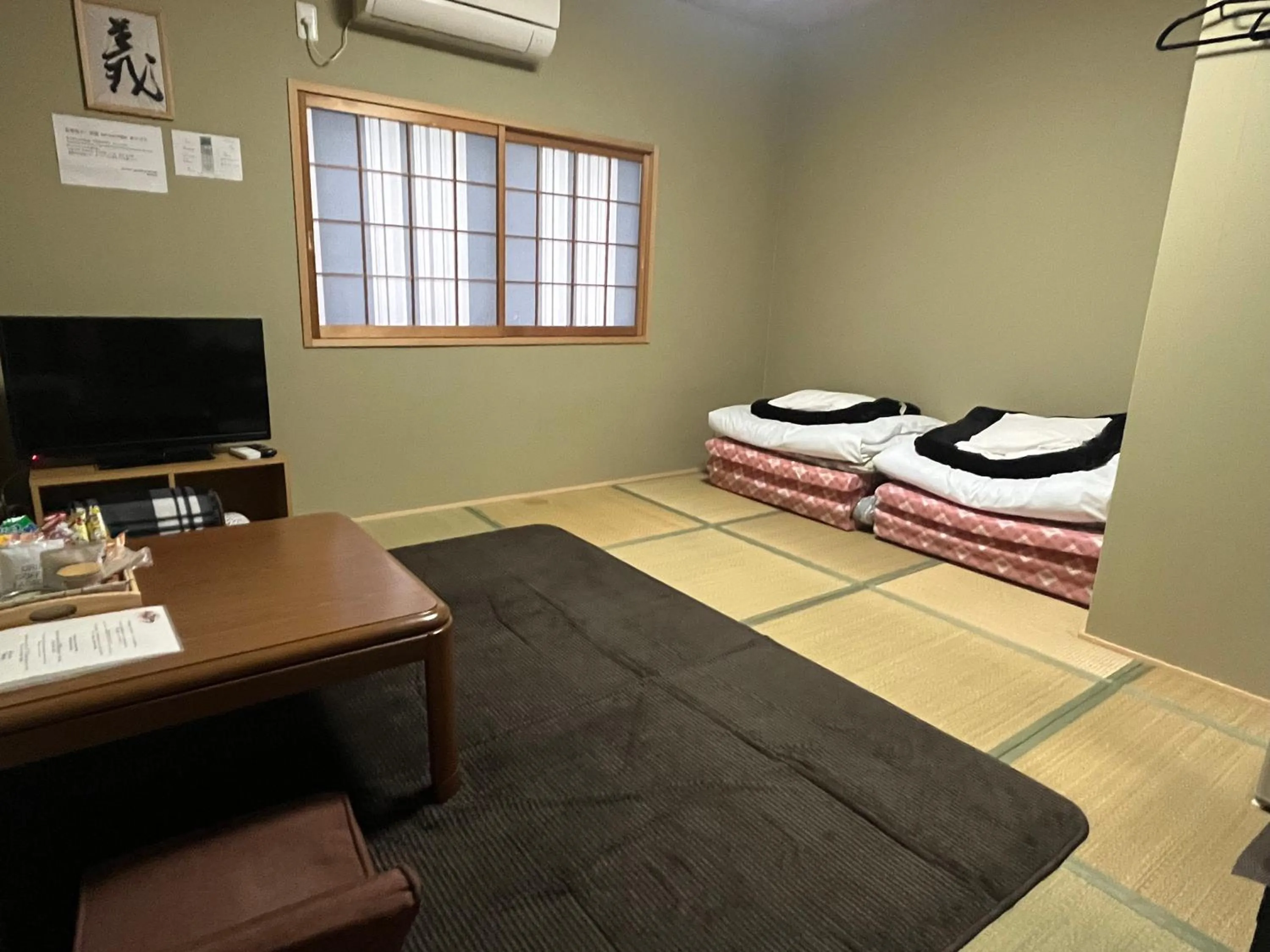 Bed in Wafu Ryokan Uehonmachi