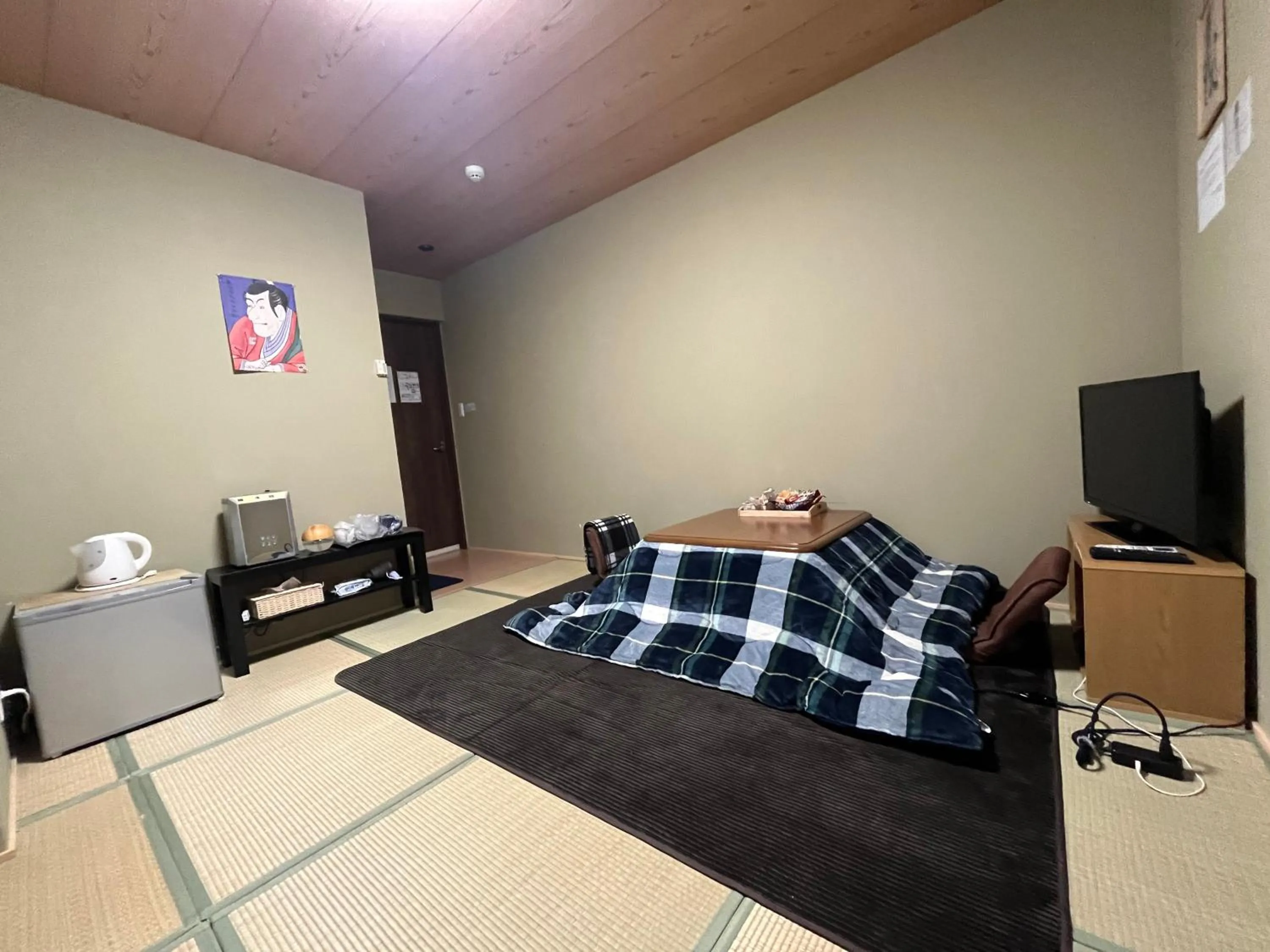 Bed in Wafu Ryokan Uehonmachi