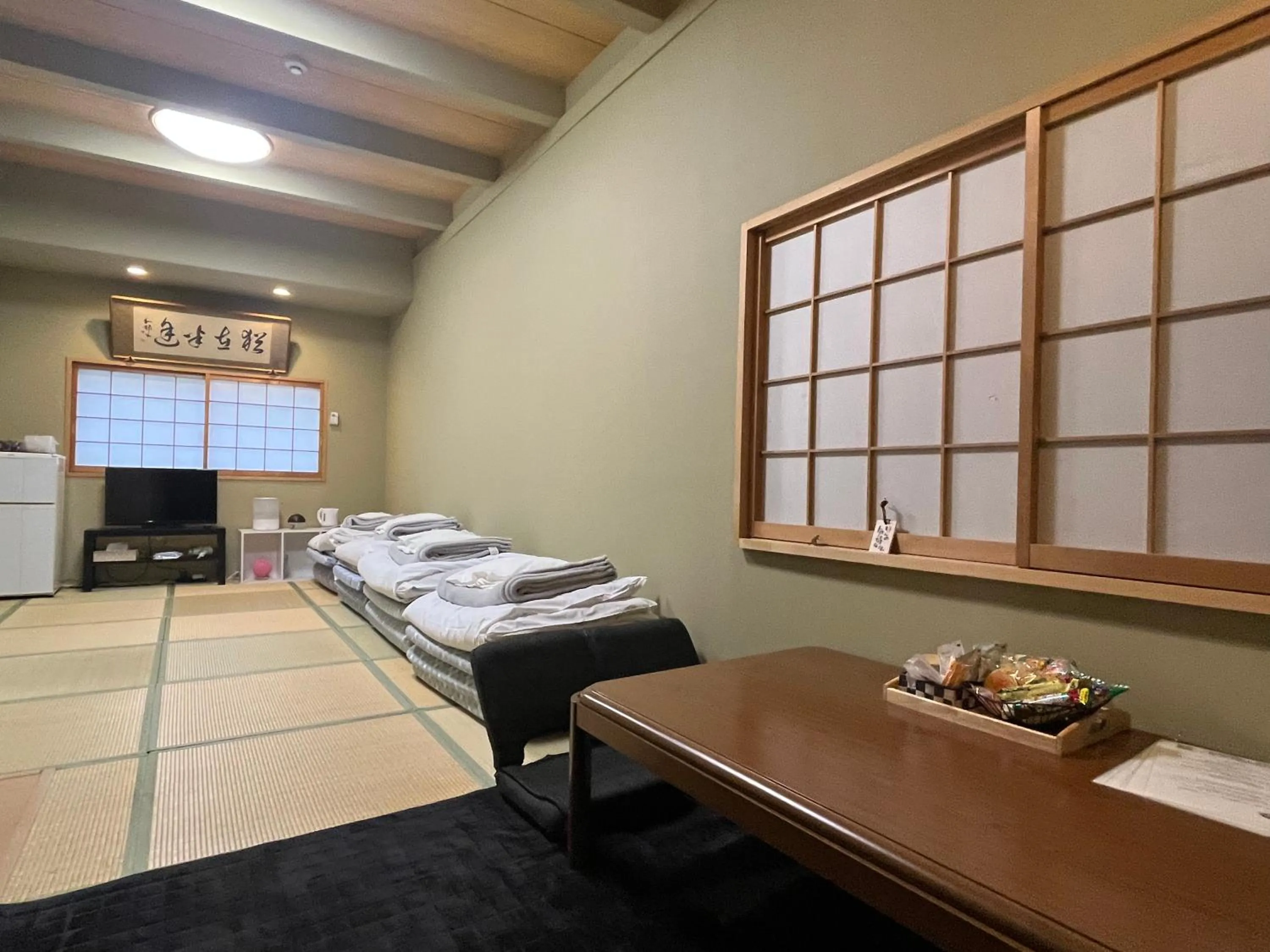 Bed in Wafu Ryokan Uehonmachi