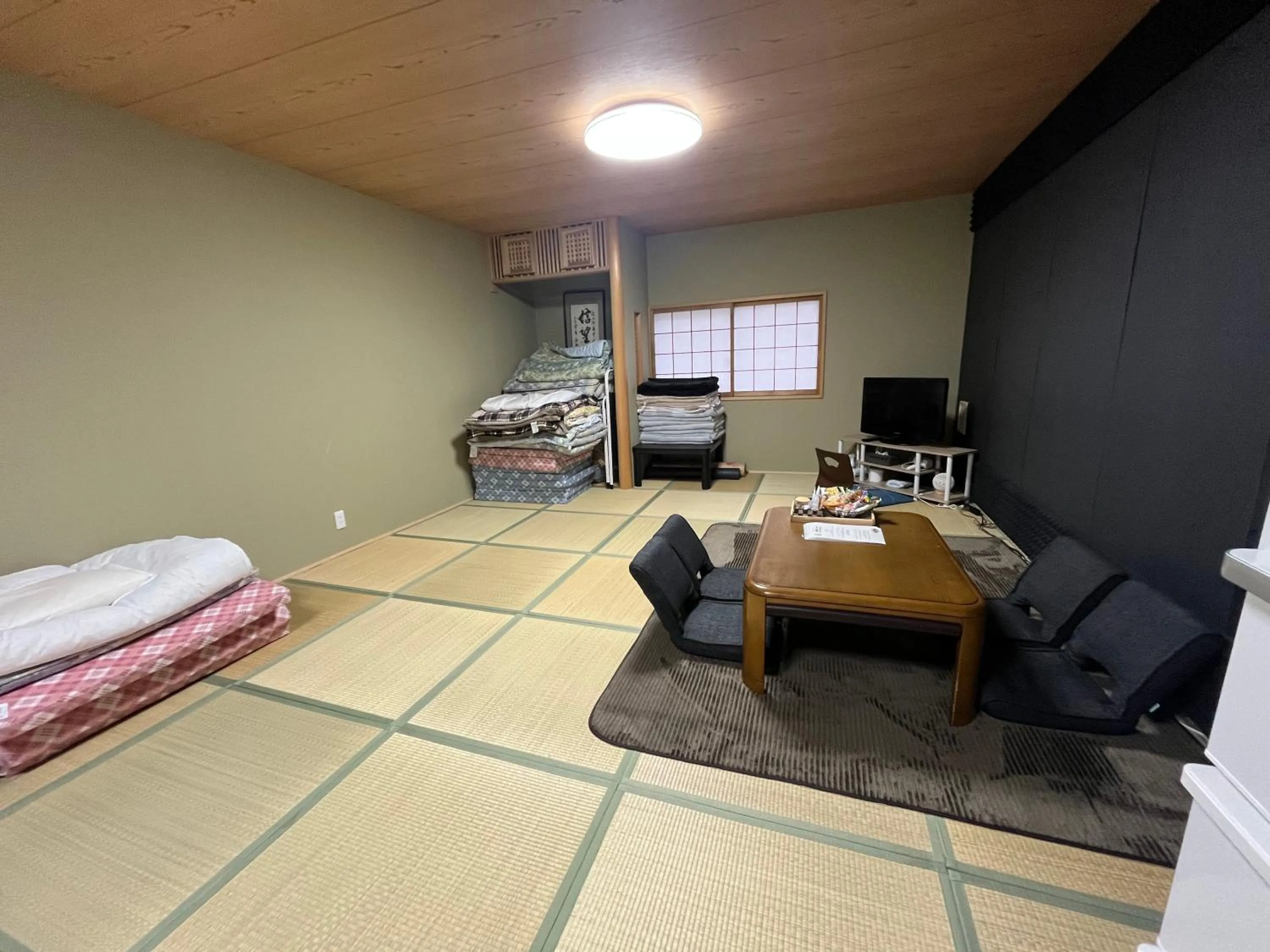 Bed in Wafu Ryokan Uehonmachi