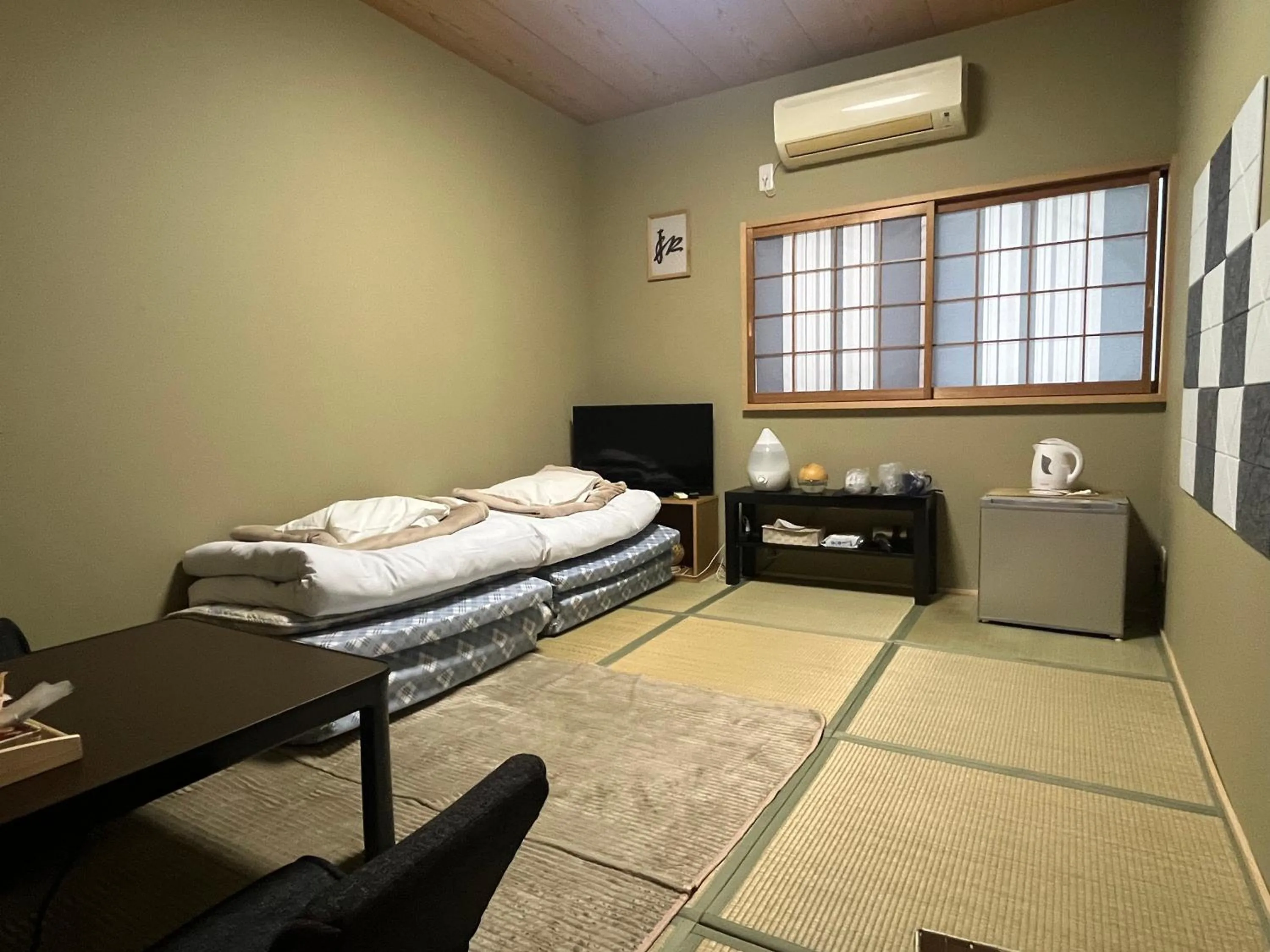 Bed in Wafu Ryokan Uehonmachi