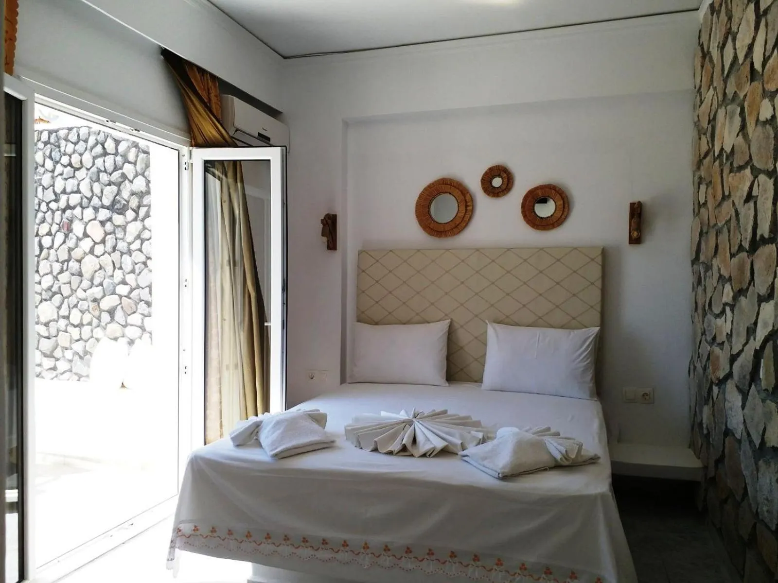 Bed in Atalos Suites