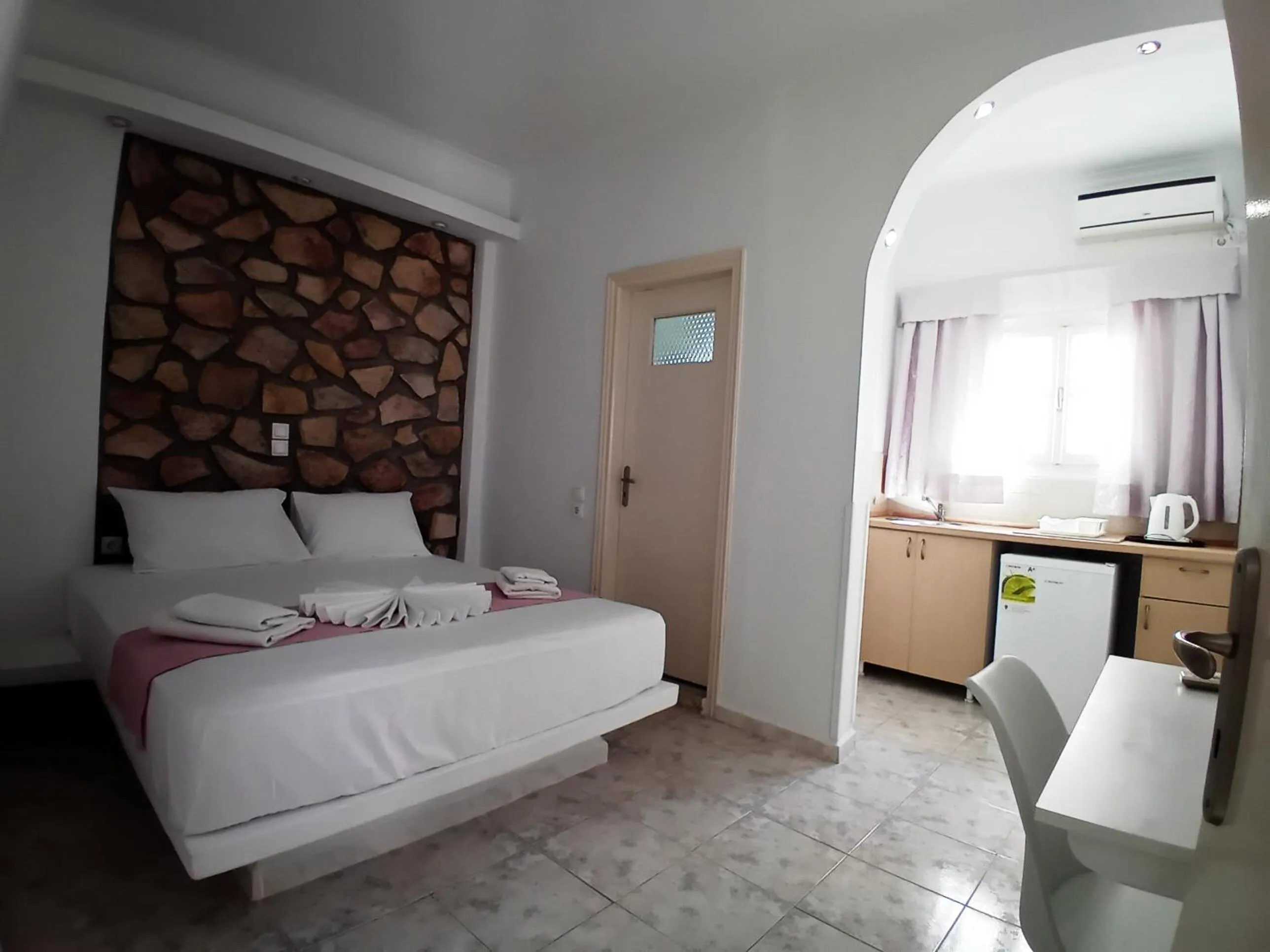 Bed in Atalos Suites