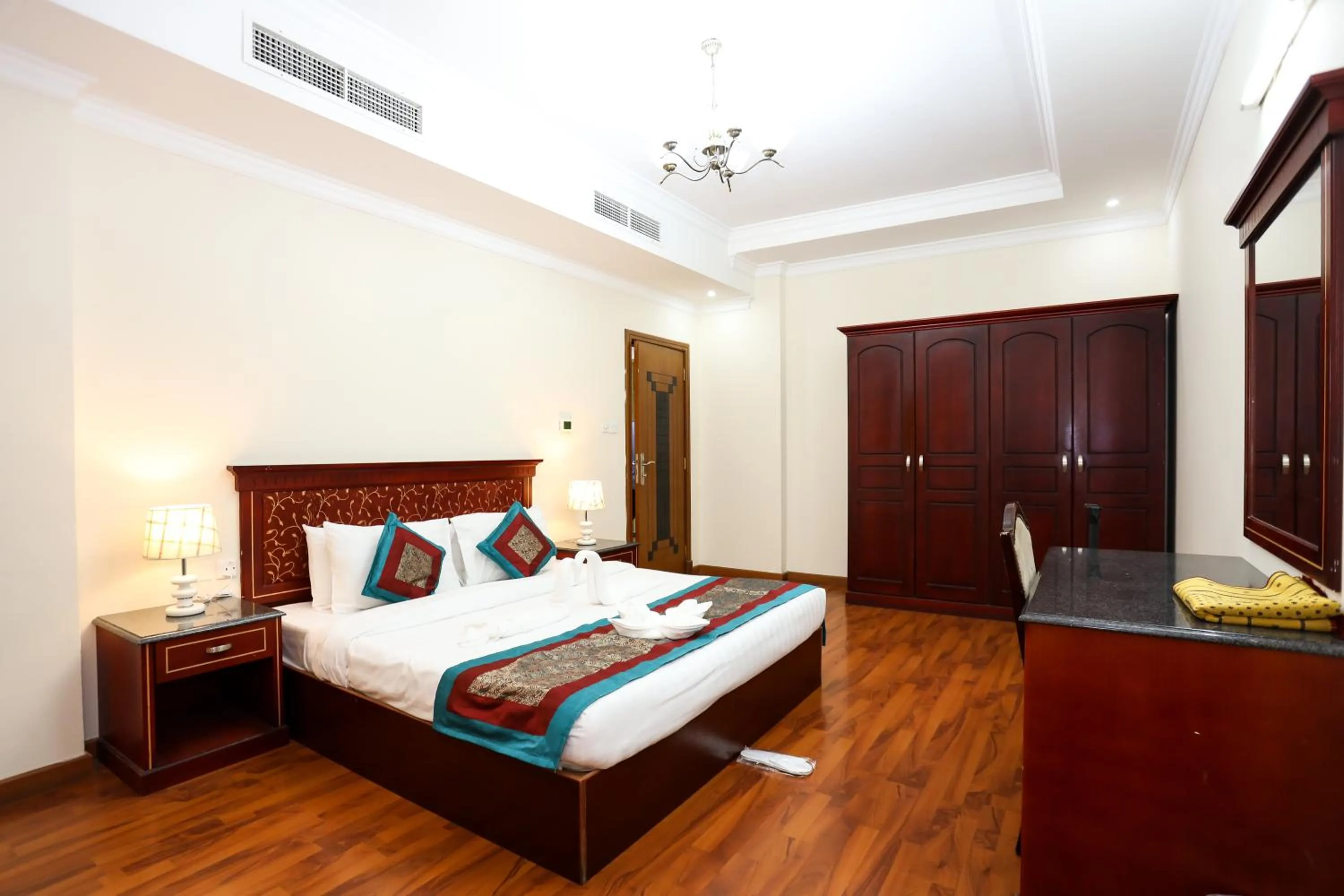 Bed in Pearl Bahrain Suites