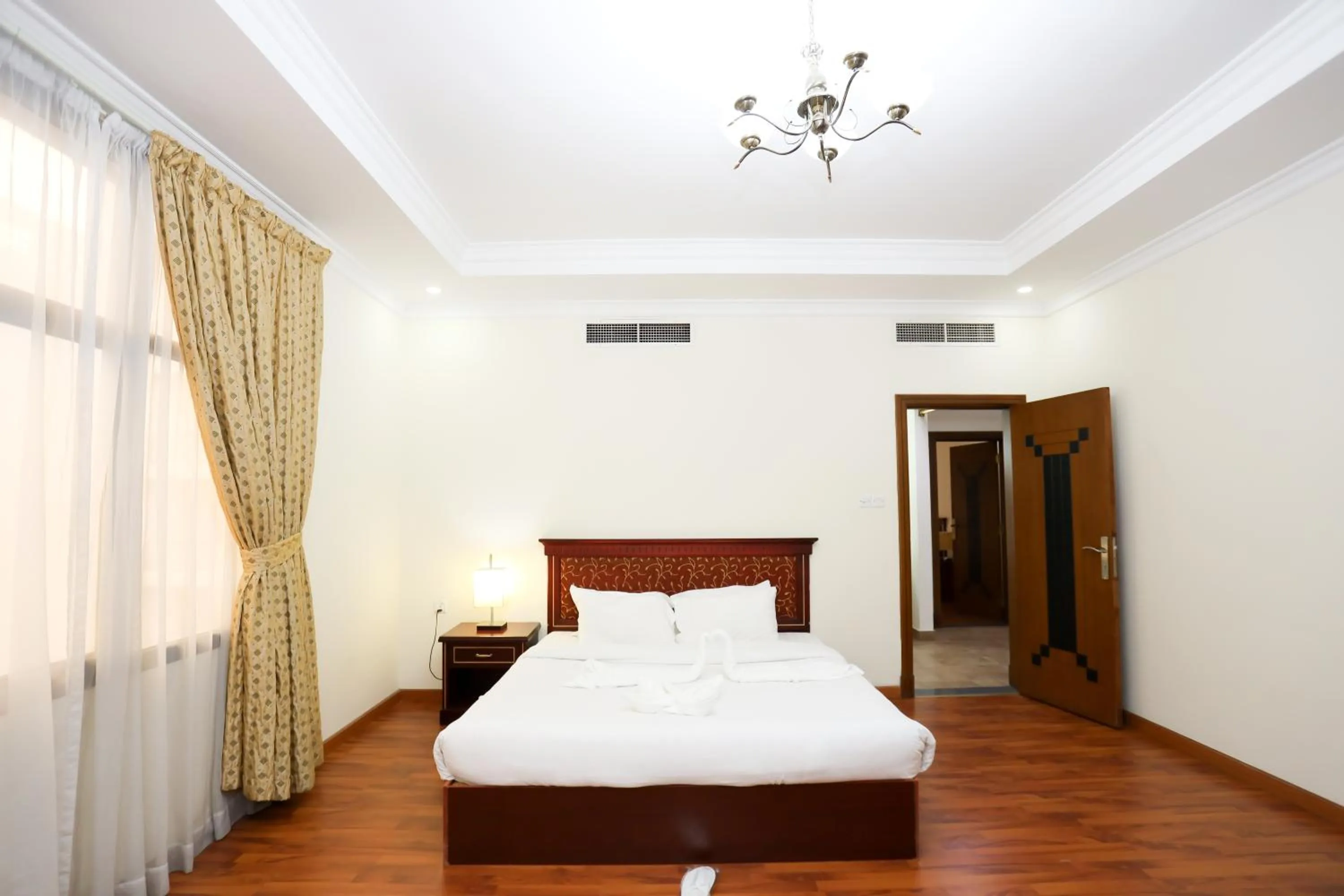 Bed in Pearl Bahrain Suites