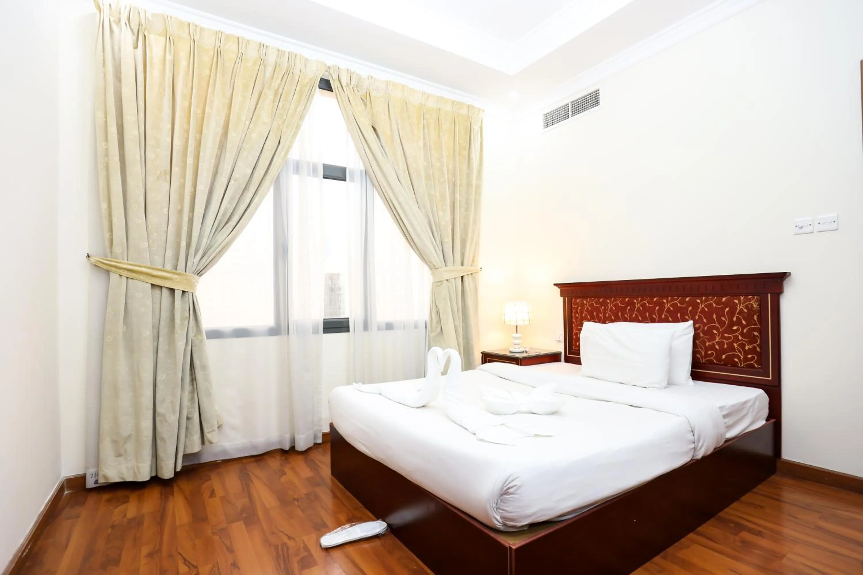 Bed in Pearl Bahrain Suites