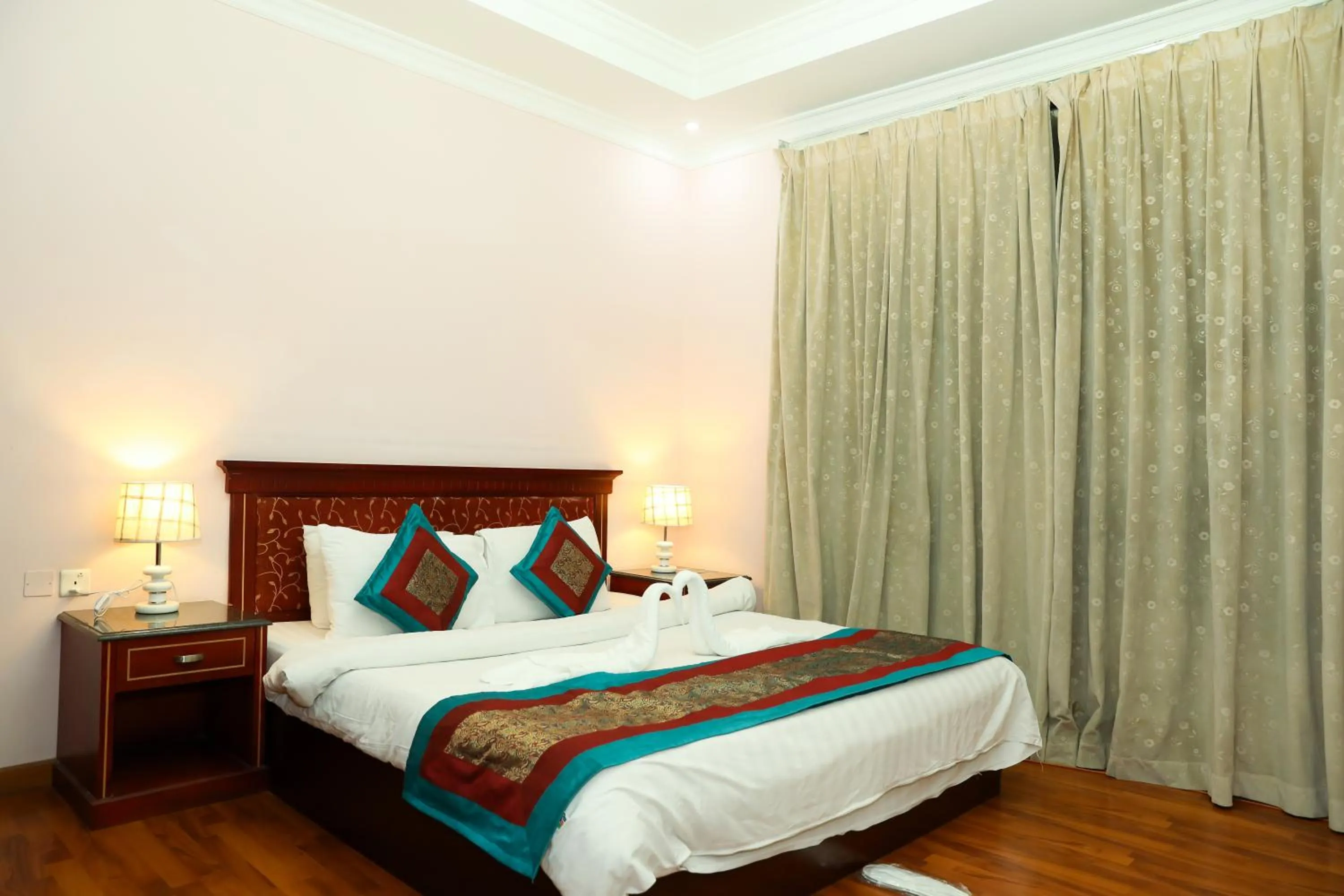 Bed in Pearl Bahrain Suites