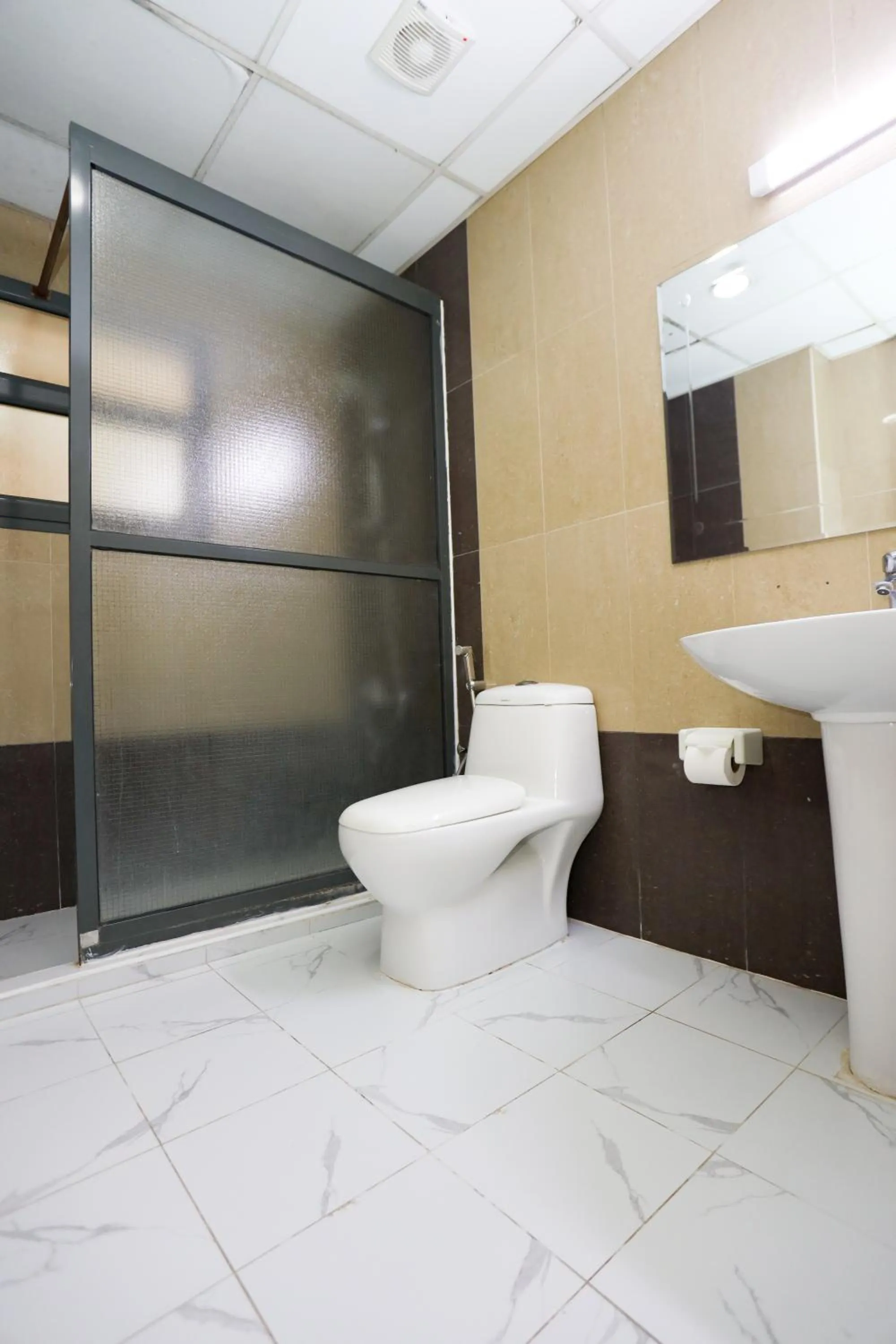 Toilet in Pearl Bahrain Suites