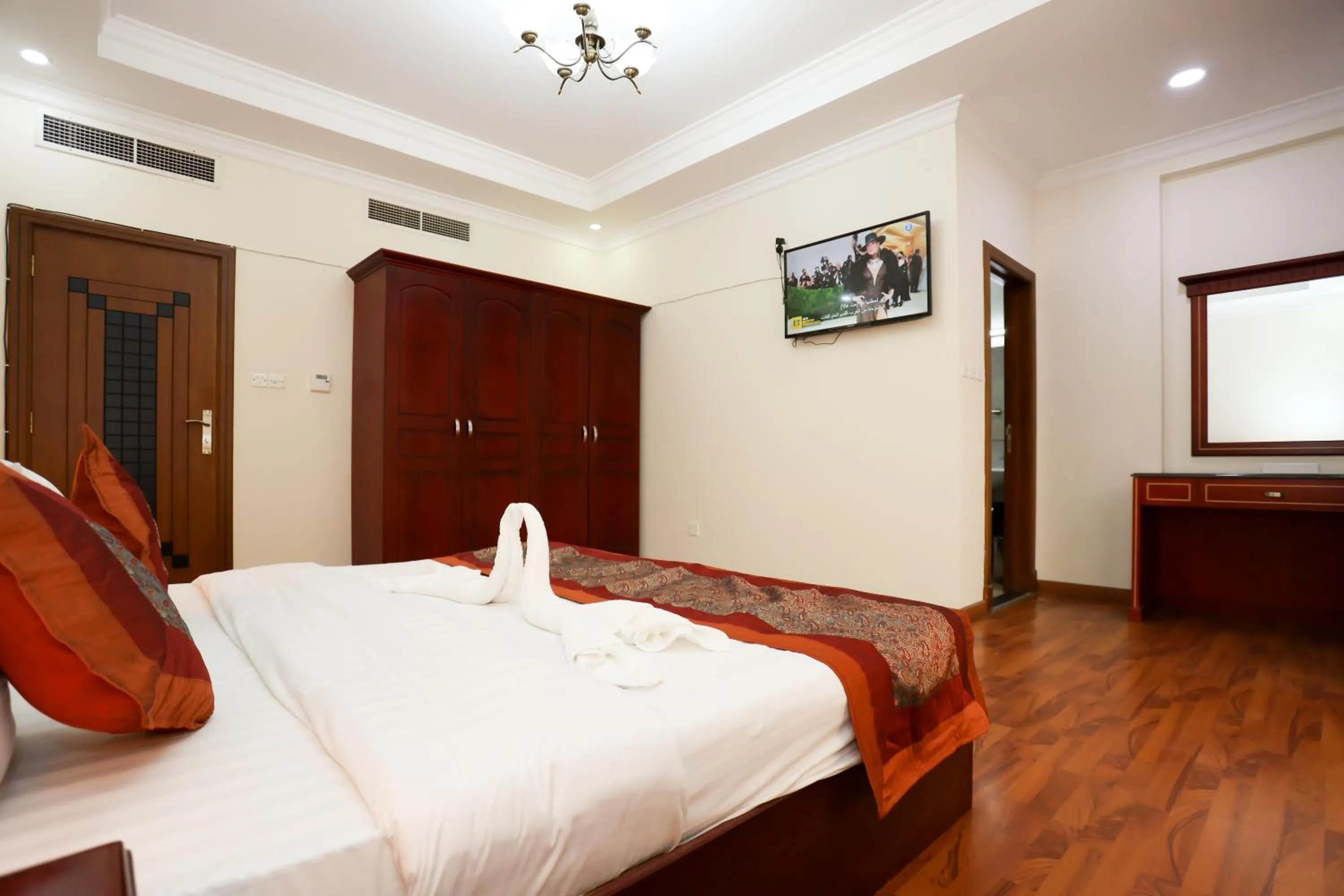 Bed in Pearl Bahrain Suites