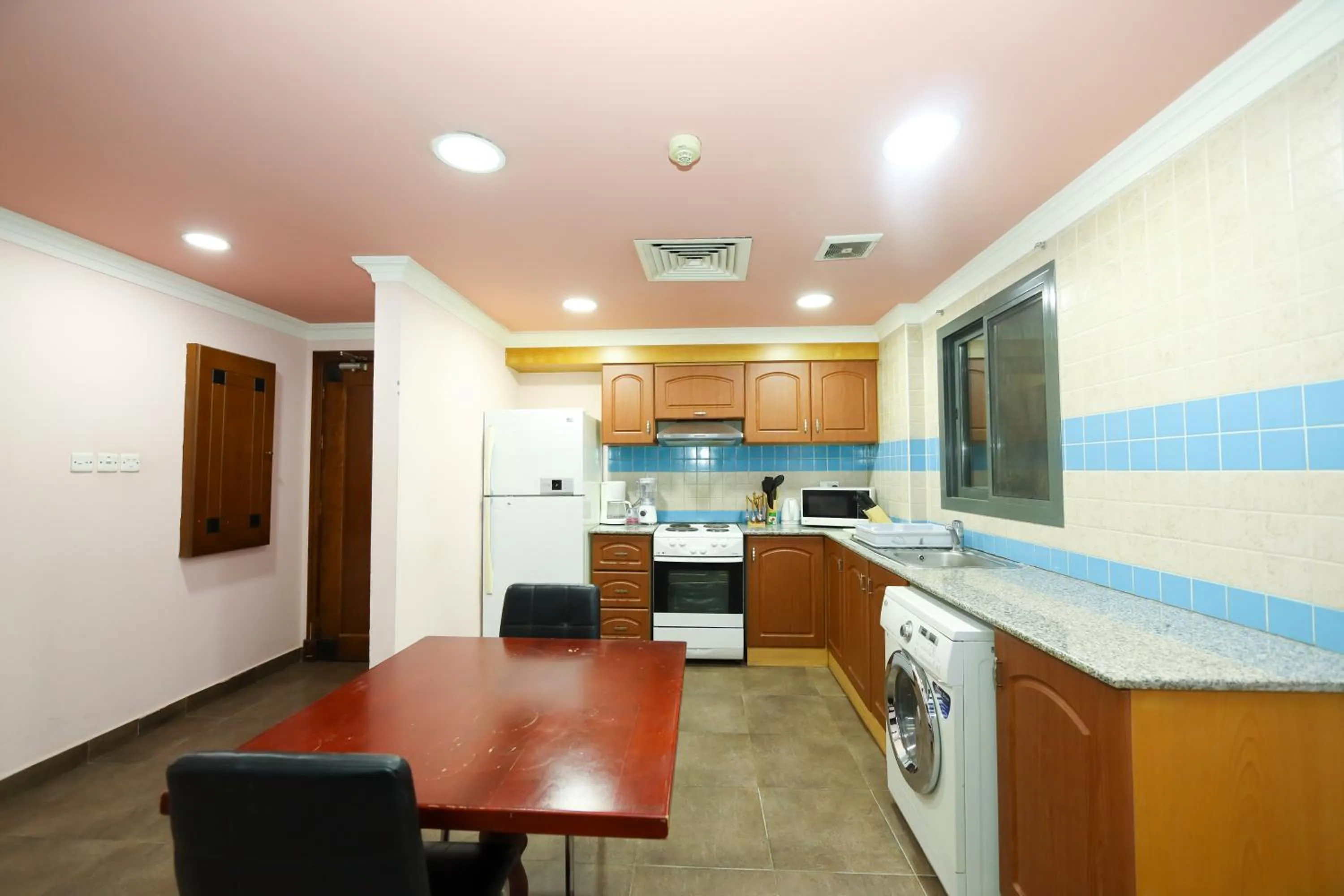 Kitchen or kitchenette in Pearl Bahrain Suites