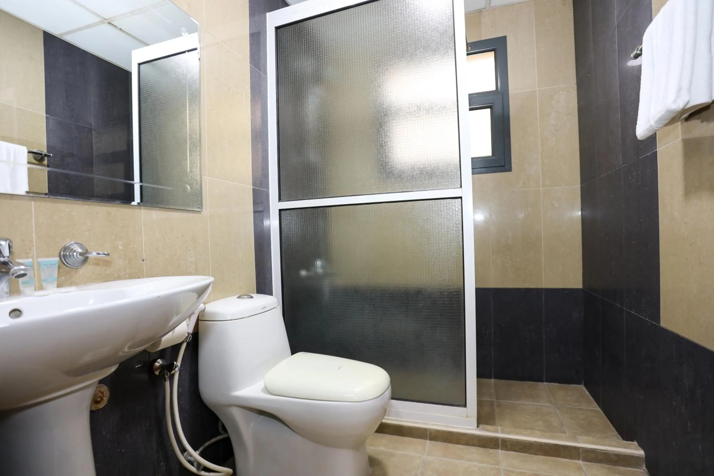 Toilet in Pearl Bahrain Suites