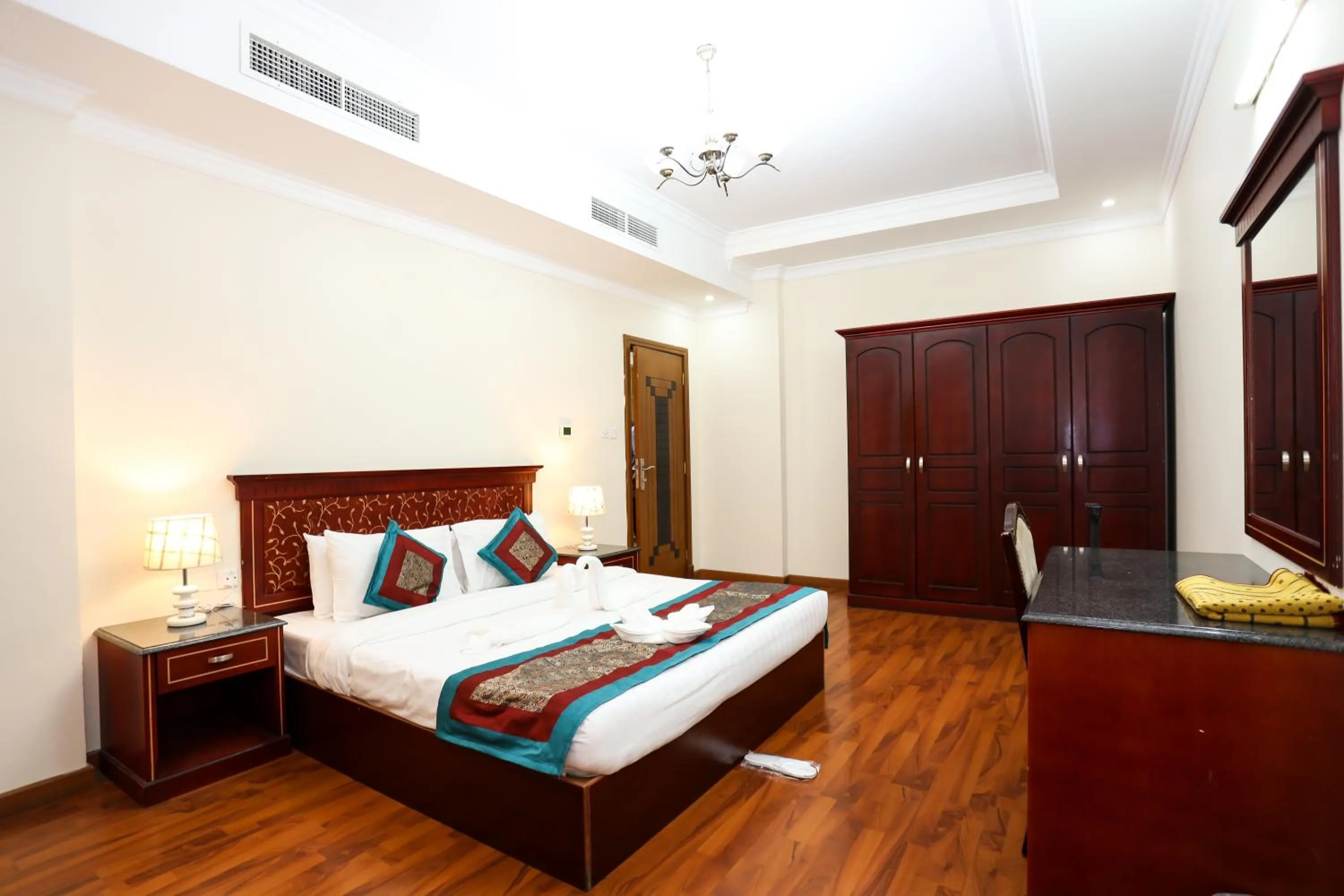 Bed in Pearl Bahrain Suites