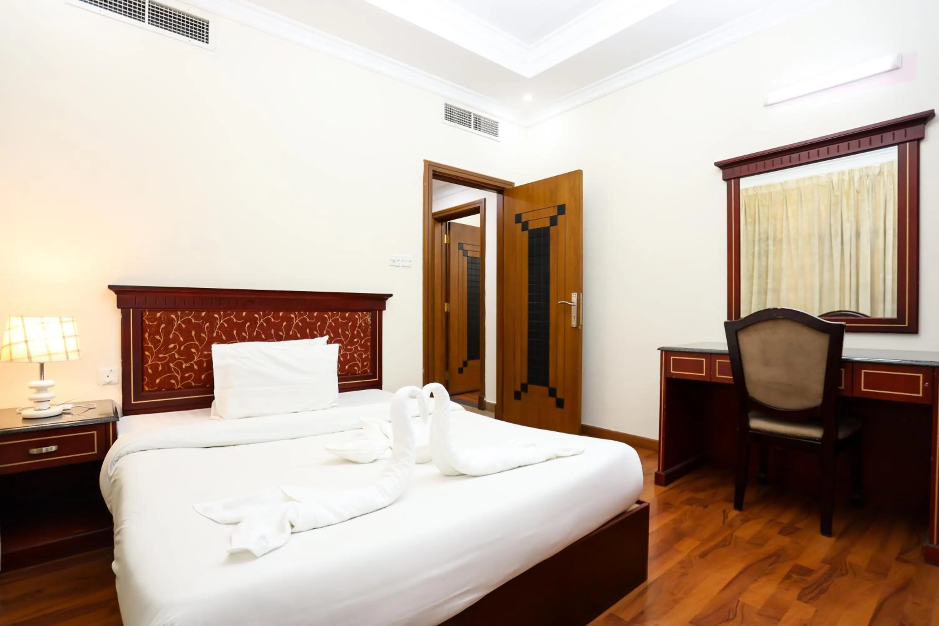 Bed in Pearl Bahrain Suites