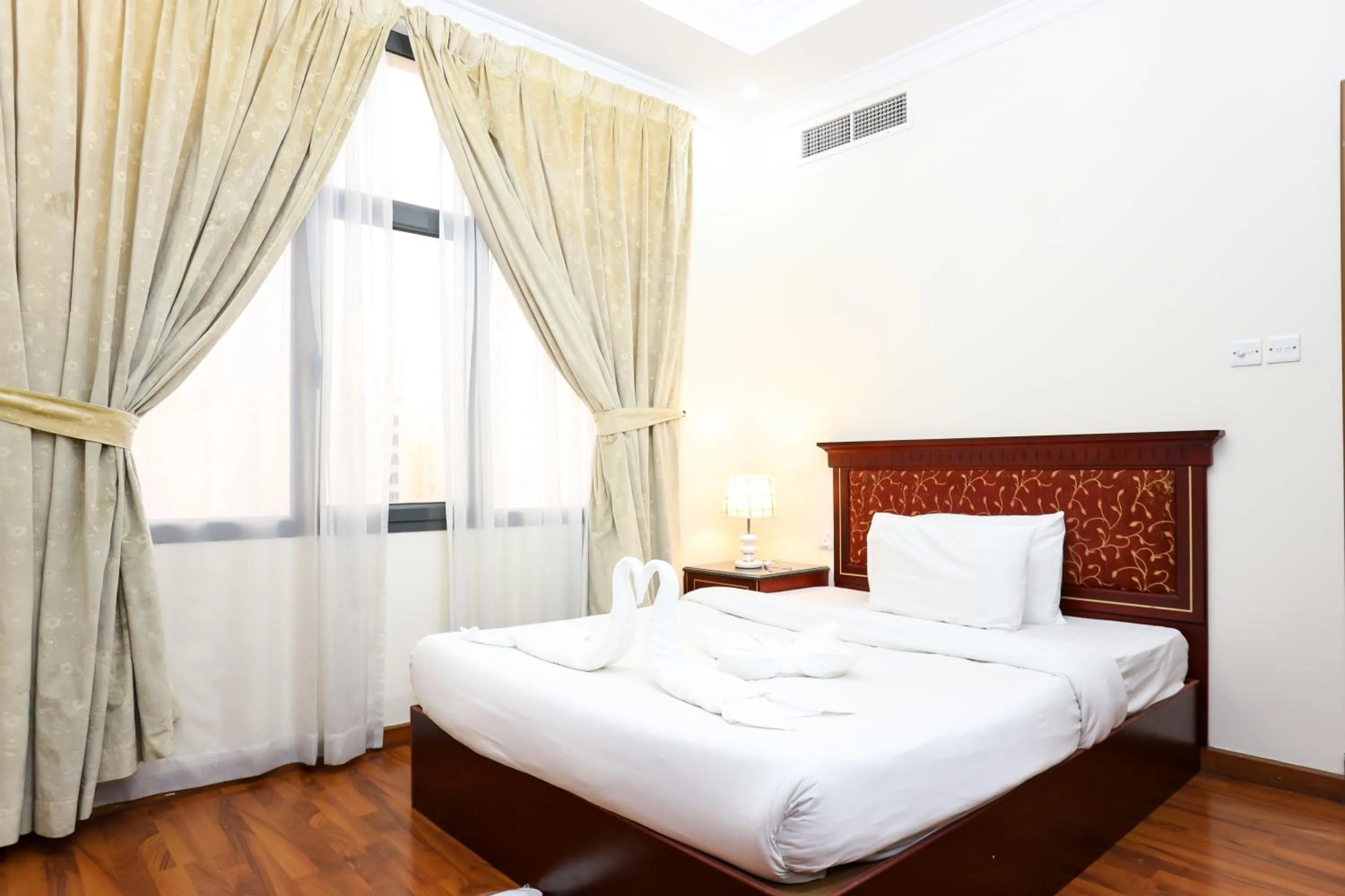 Bed in Pearl Bahrain Suites