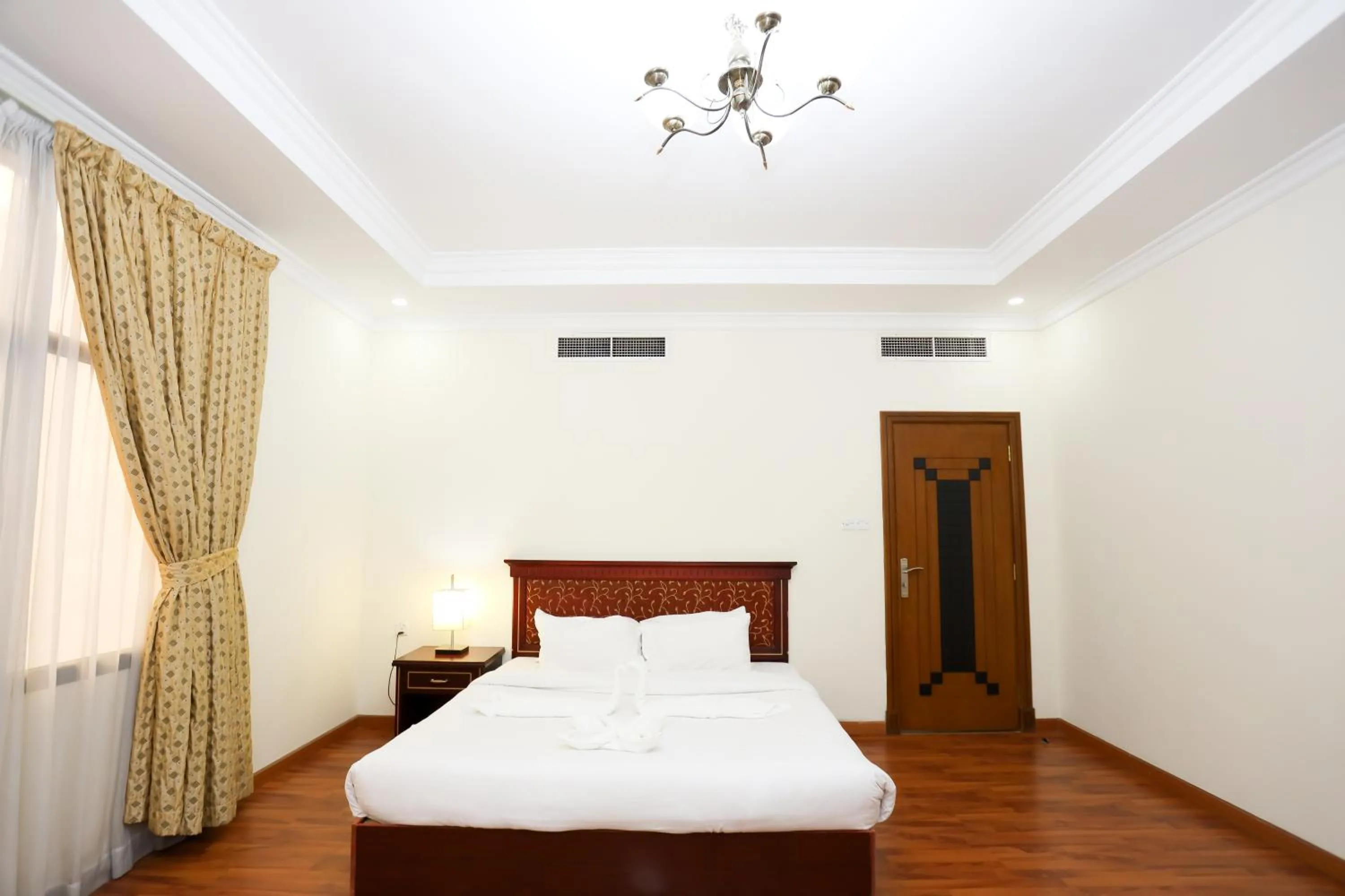 Bed in Pearl Bahrain Suites