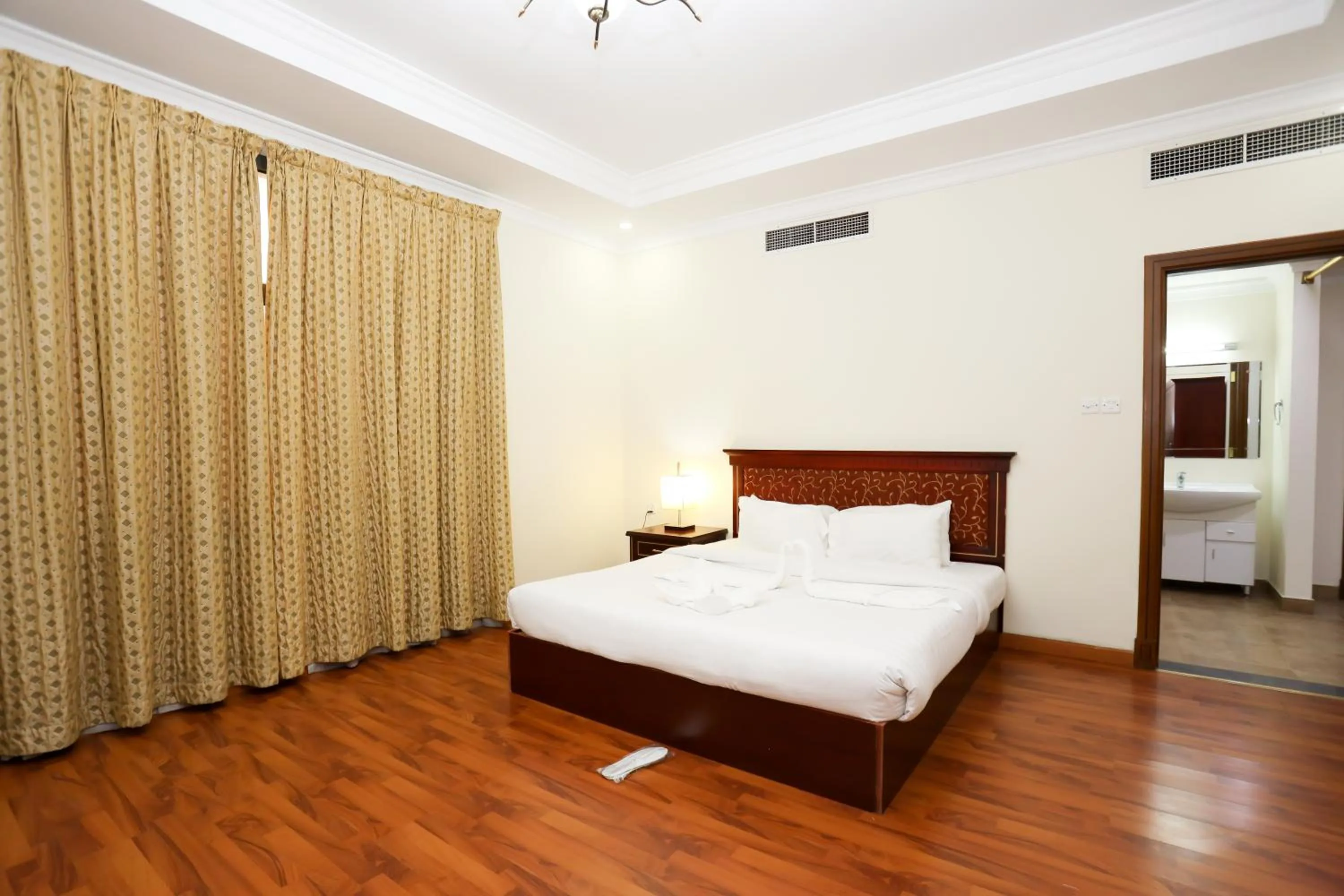 Bed in Pearl Bahrain Suites