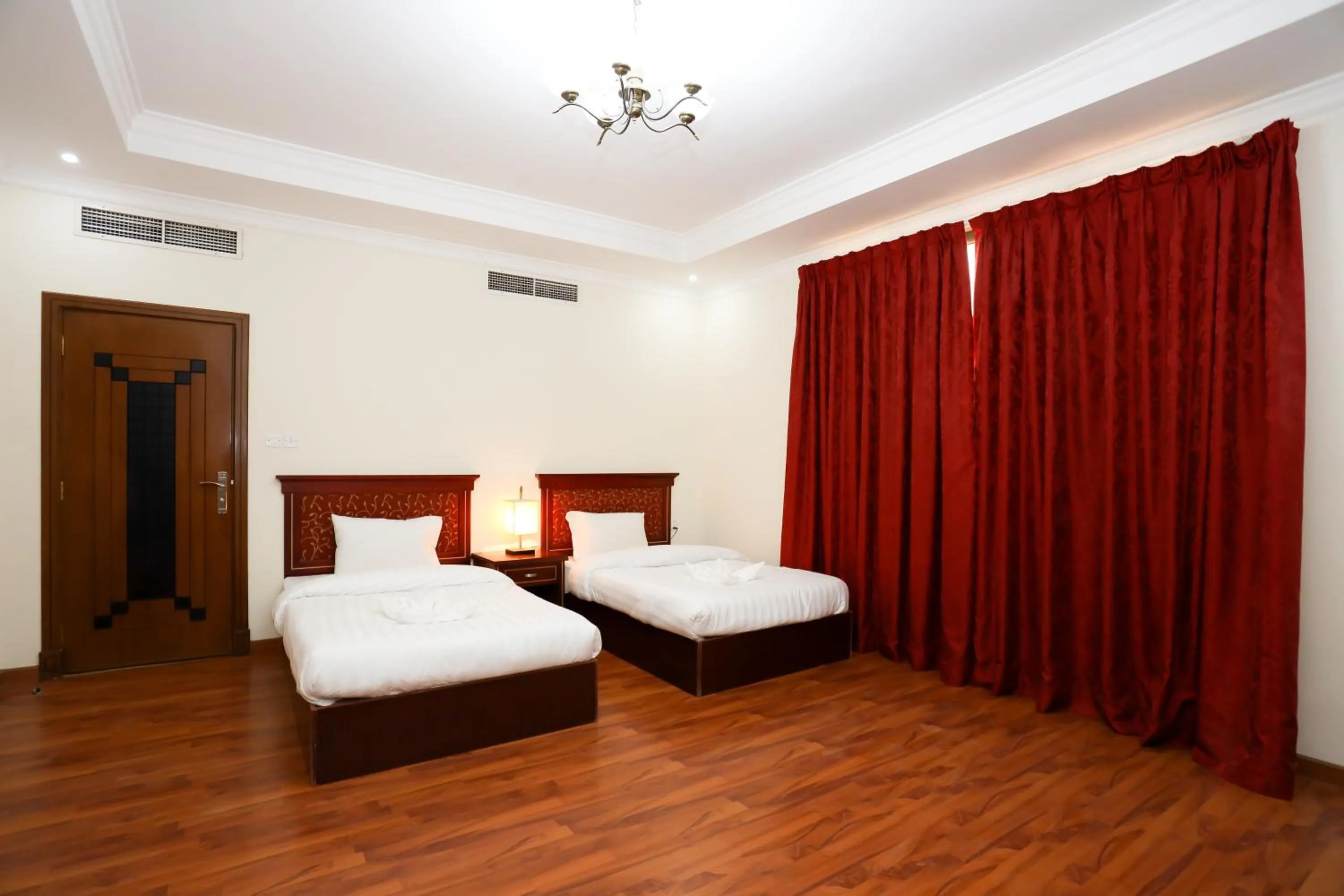 Bed in Pearl Bahrain Suites