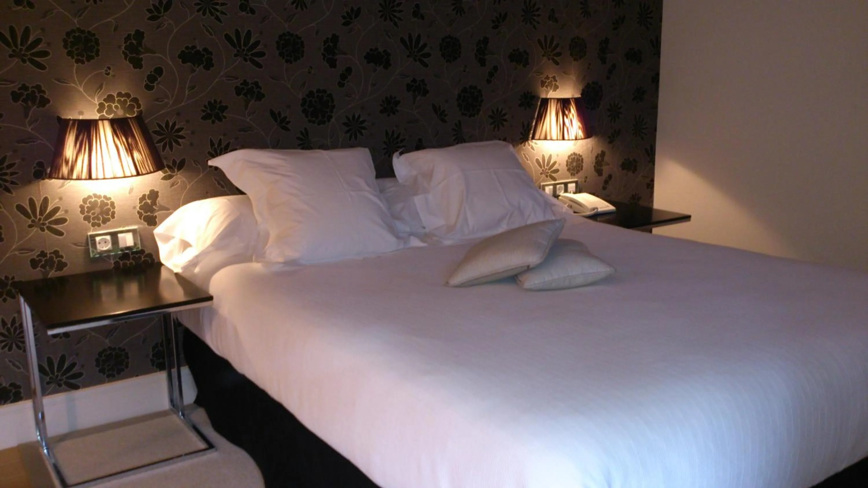 Bed in Hotel Palacio Muñatones