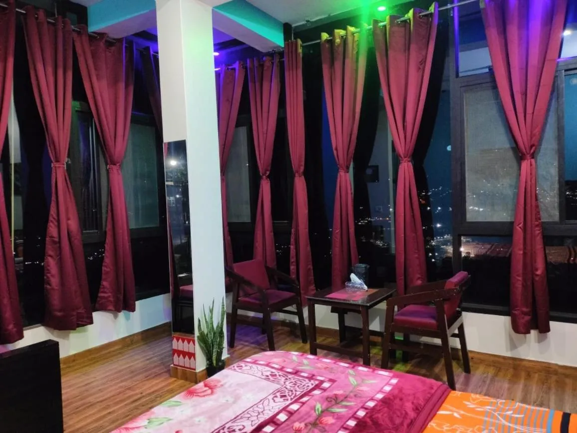 Bed in MangalMurti Himalyan Hotel