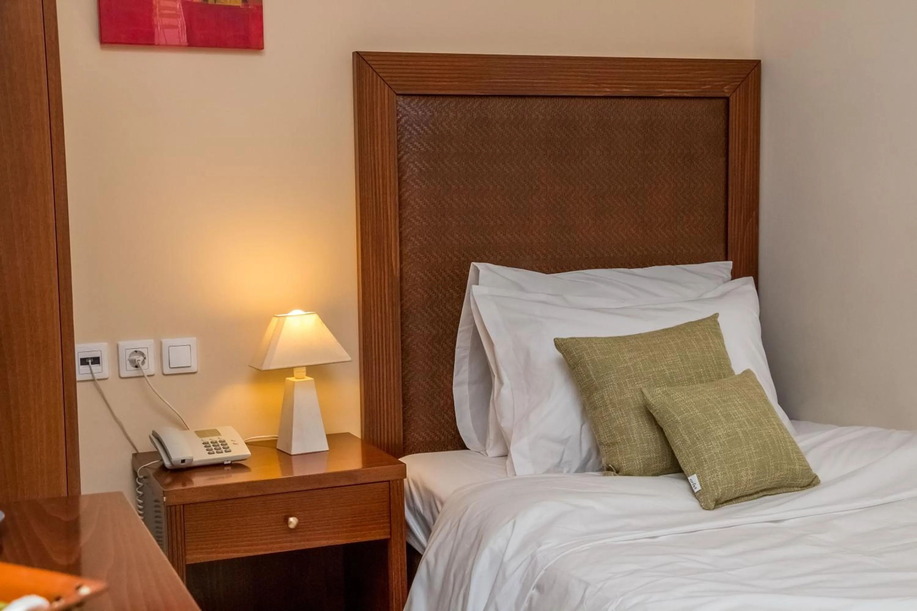 Bed in Apollo Resort Art Hotel