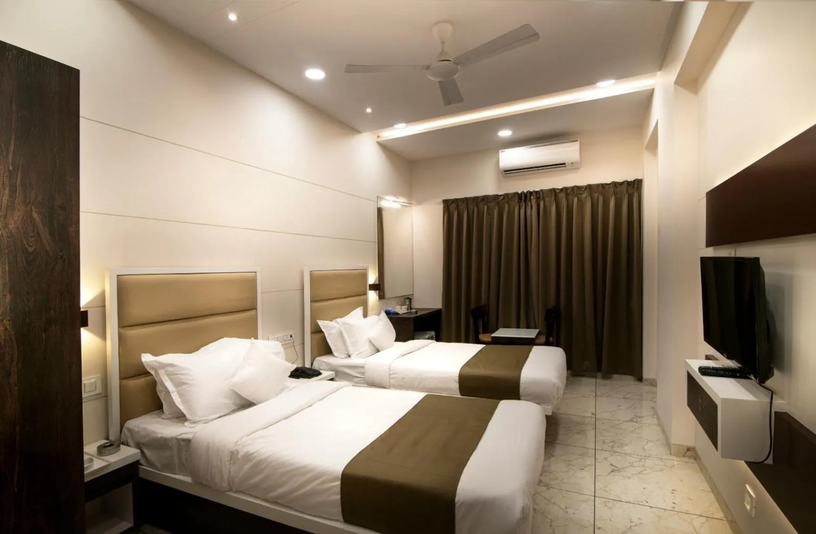 Bed in Hotel Royal Treat Surat