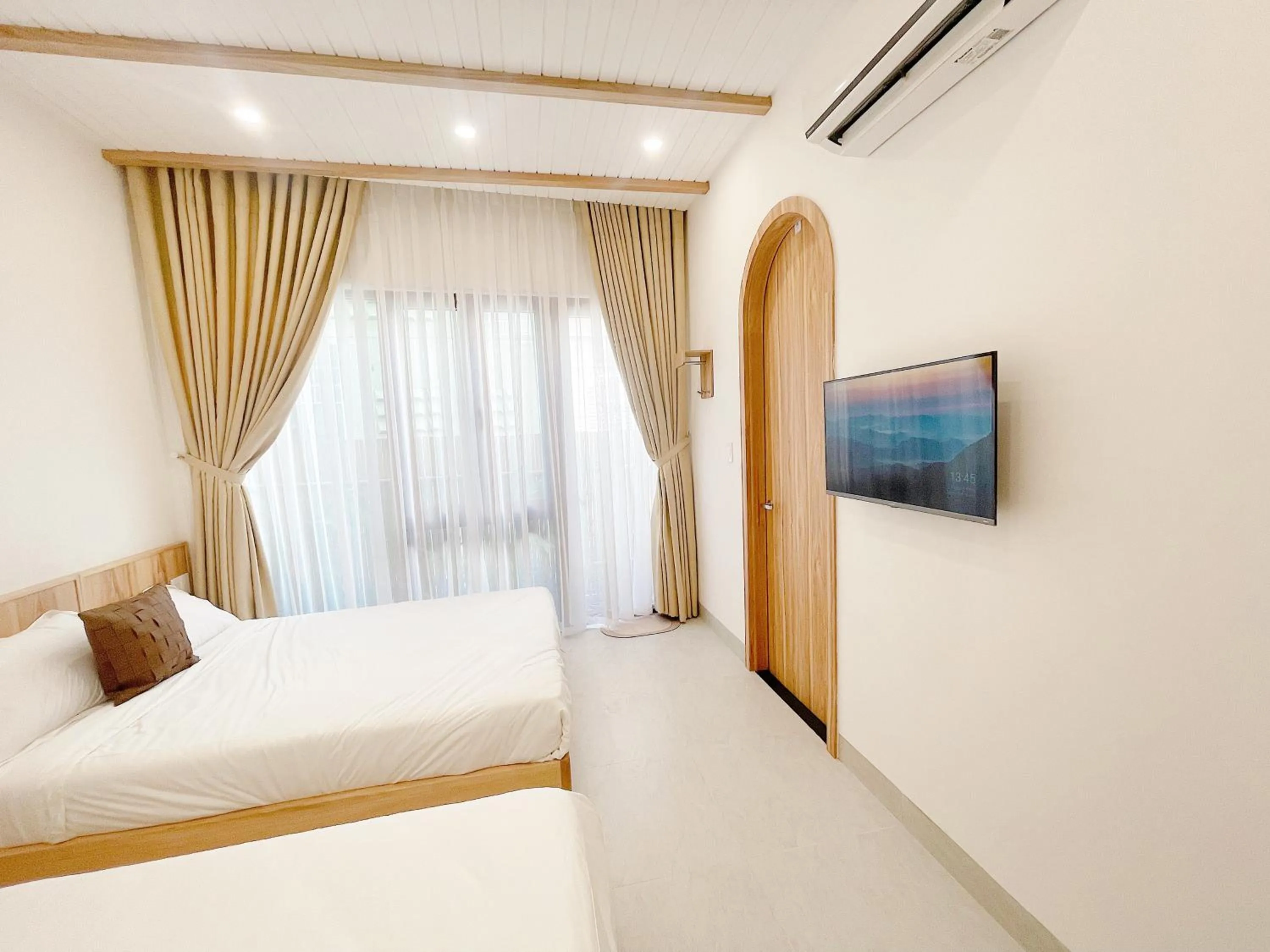 Bedroom, Bed in Baphu Beachwalk Apartment - 5 min walk to My Khe beach