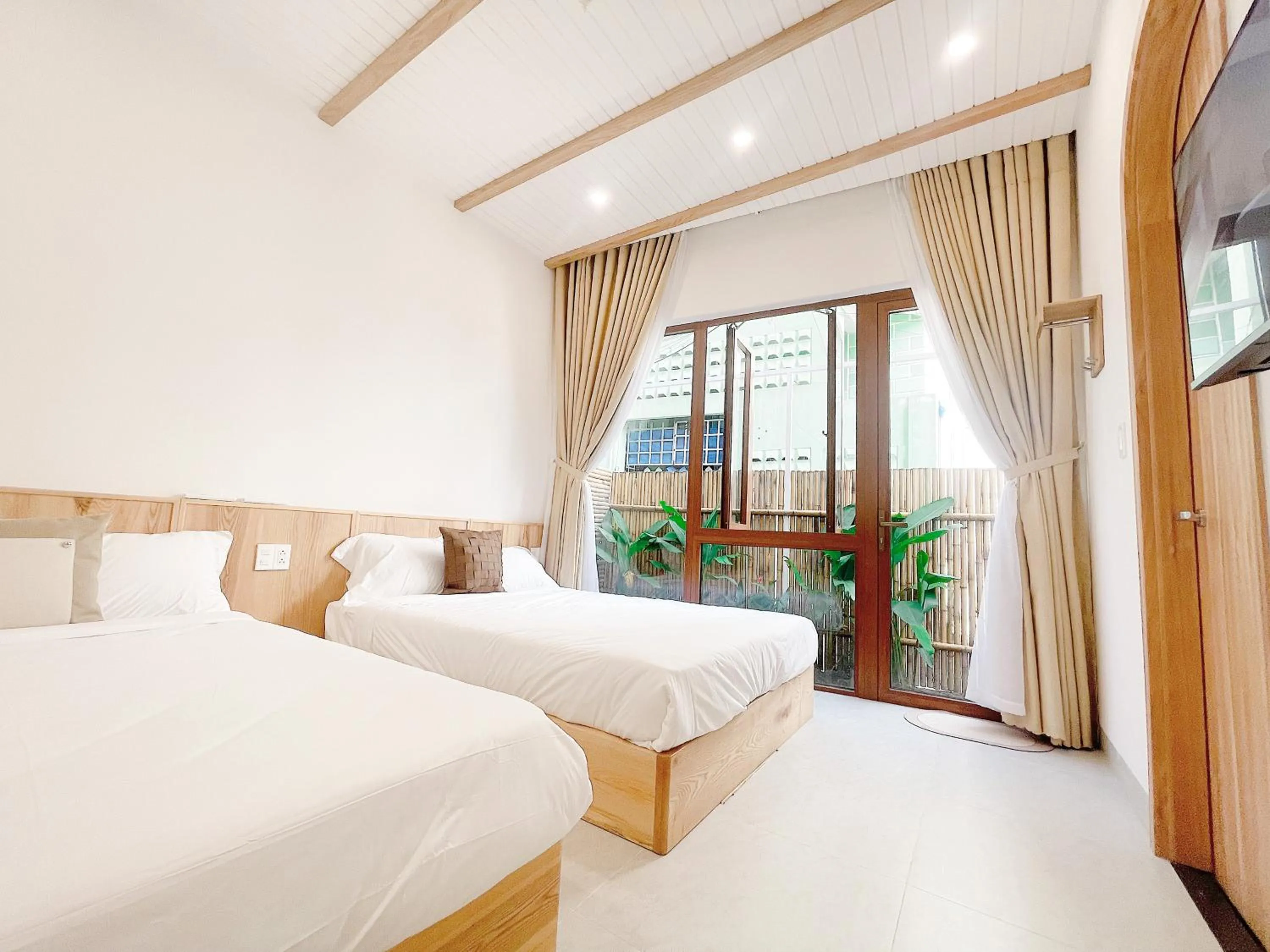 Bedroom, Bed in Baphu Beachwalk Apartment - 5 min walk to My Khe beach