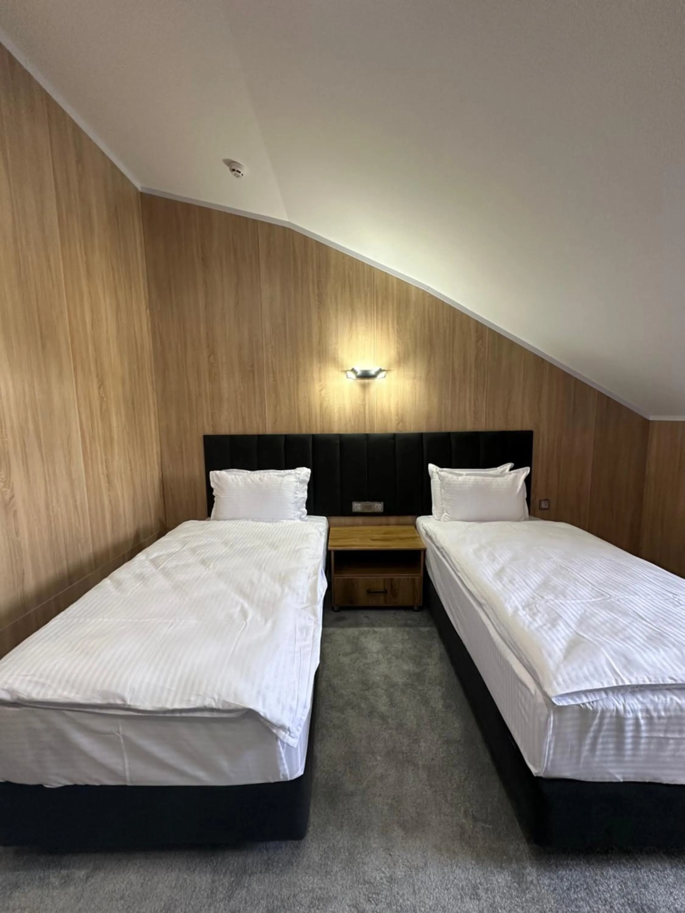 Bed in WELLFORT HOTEL