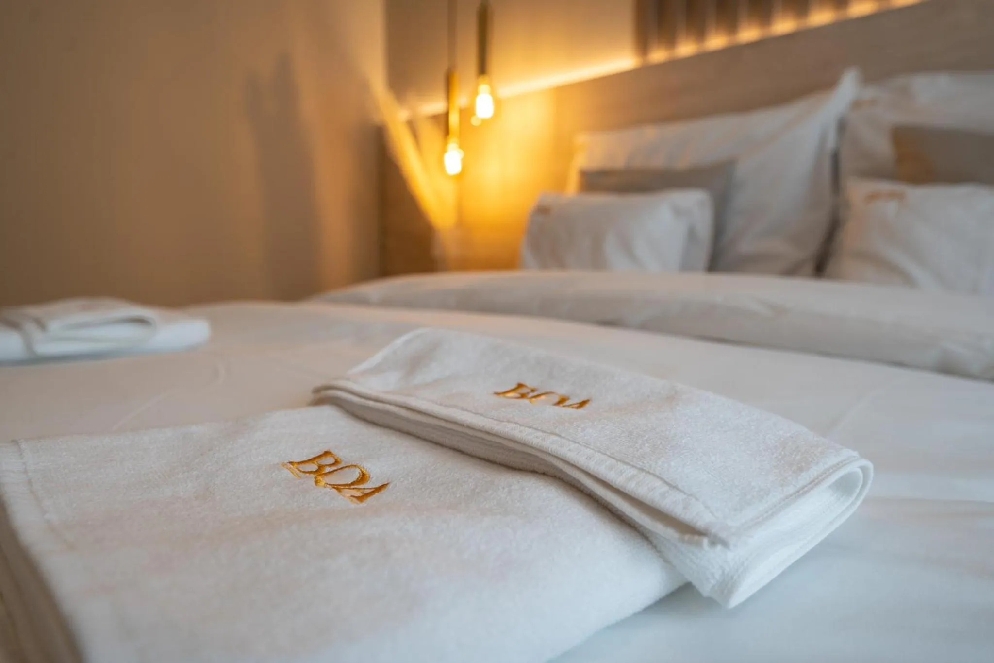 Bed in Karoly Boutique Suites, Best Location by BQA