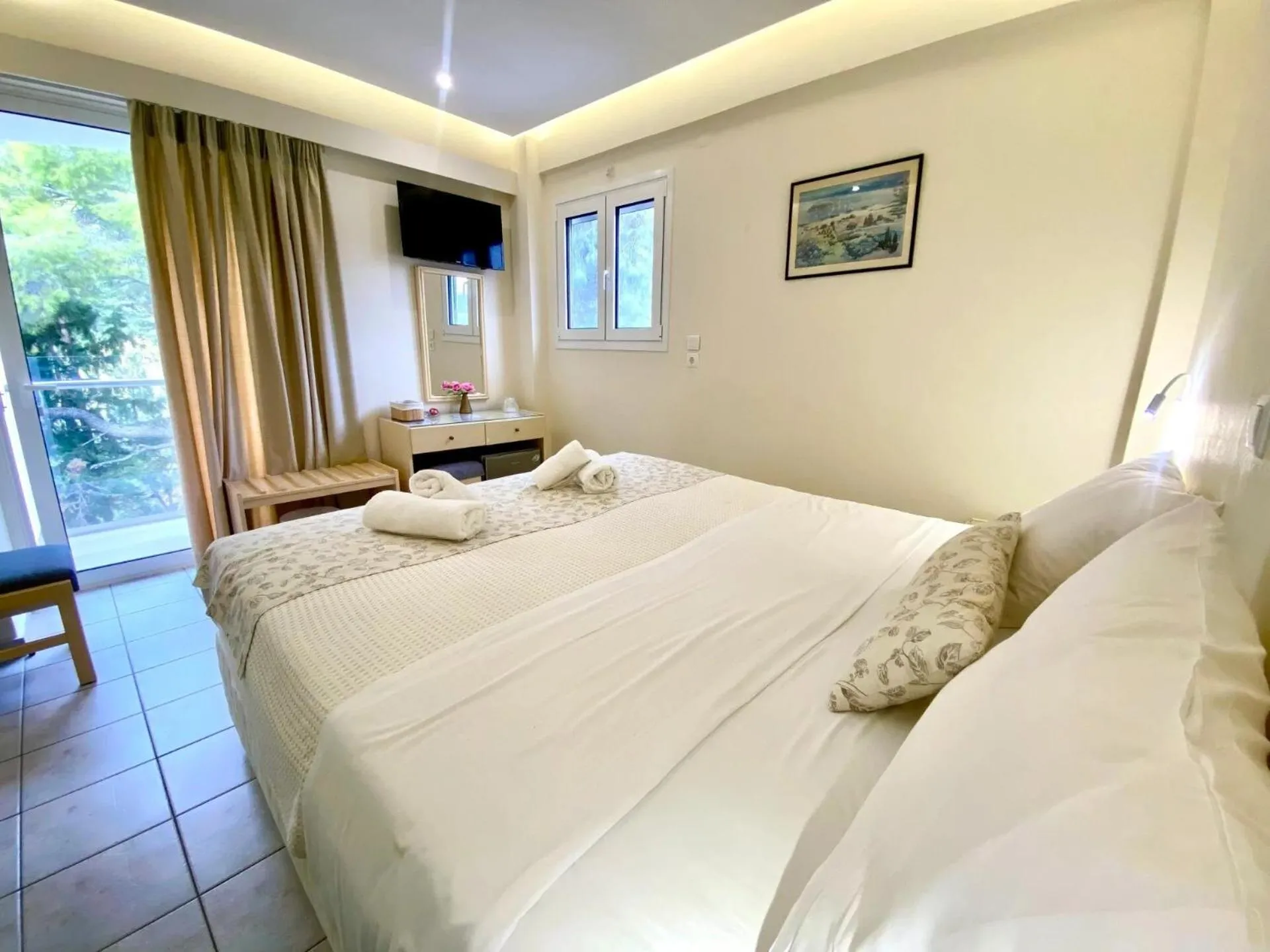 Bed in New Aegli Resort Hotel