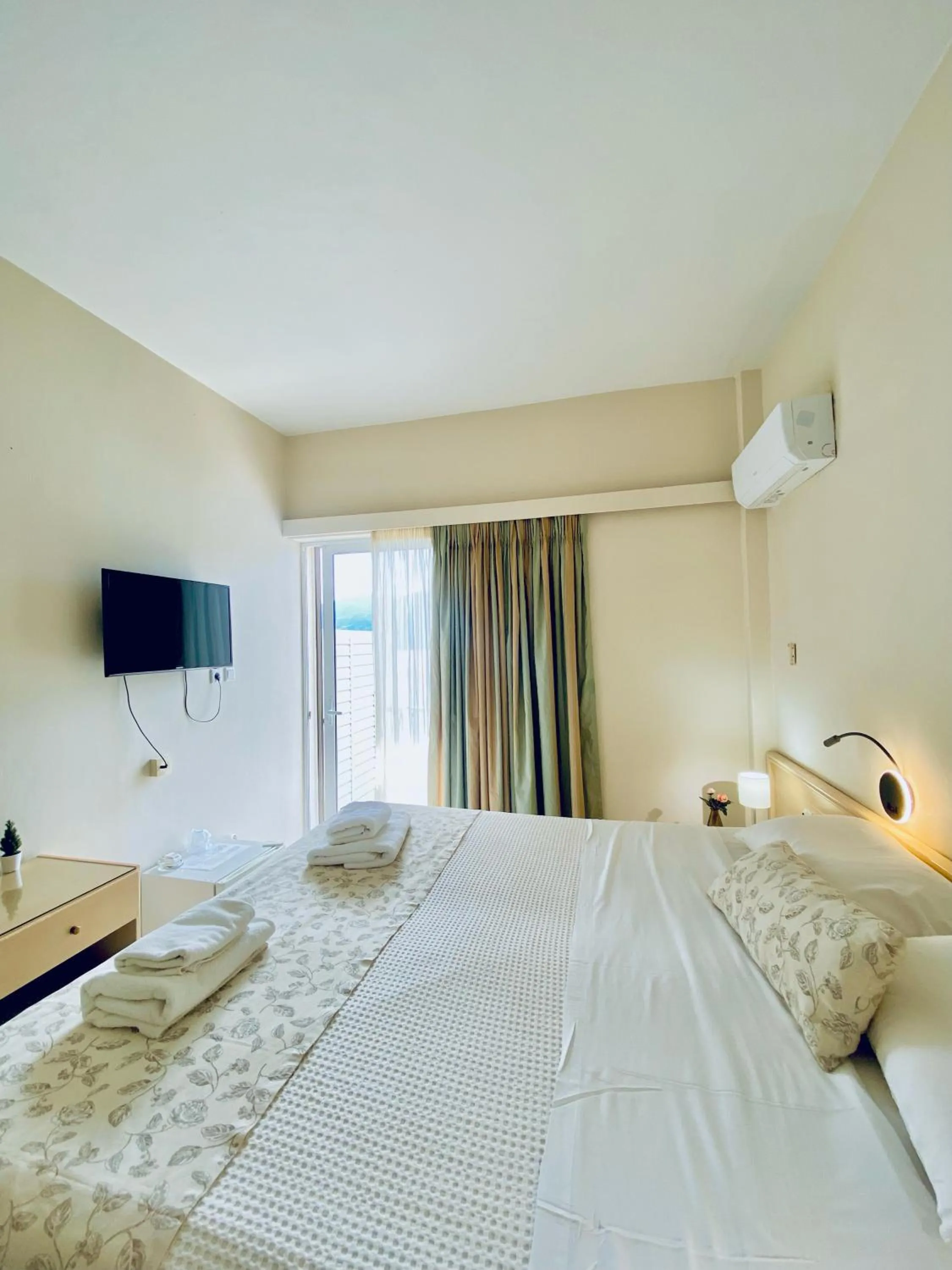 Bed in New Aegli Resort Hotel