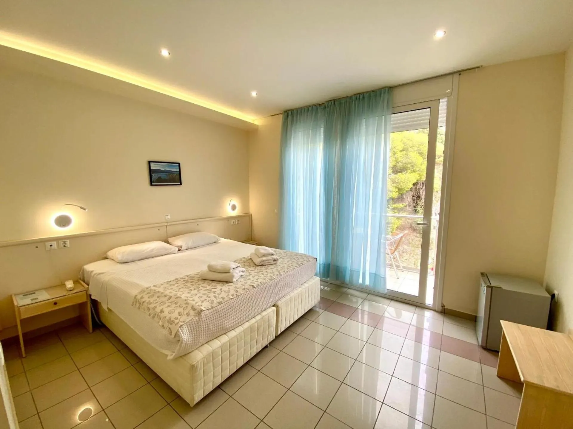 Bed in New Aegli Resort Hotel