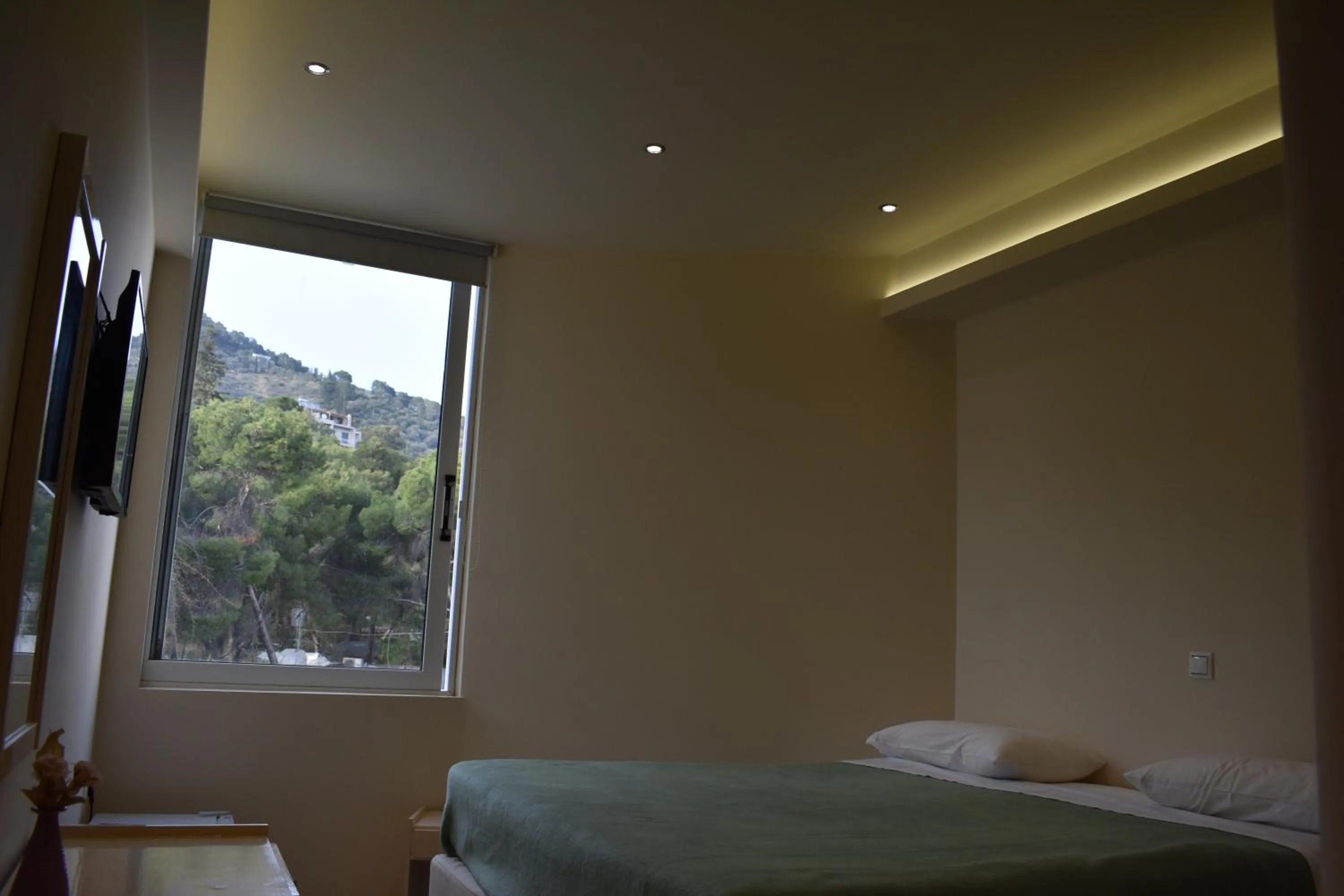 Bed in New Aegli Resort Hotel