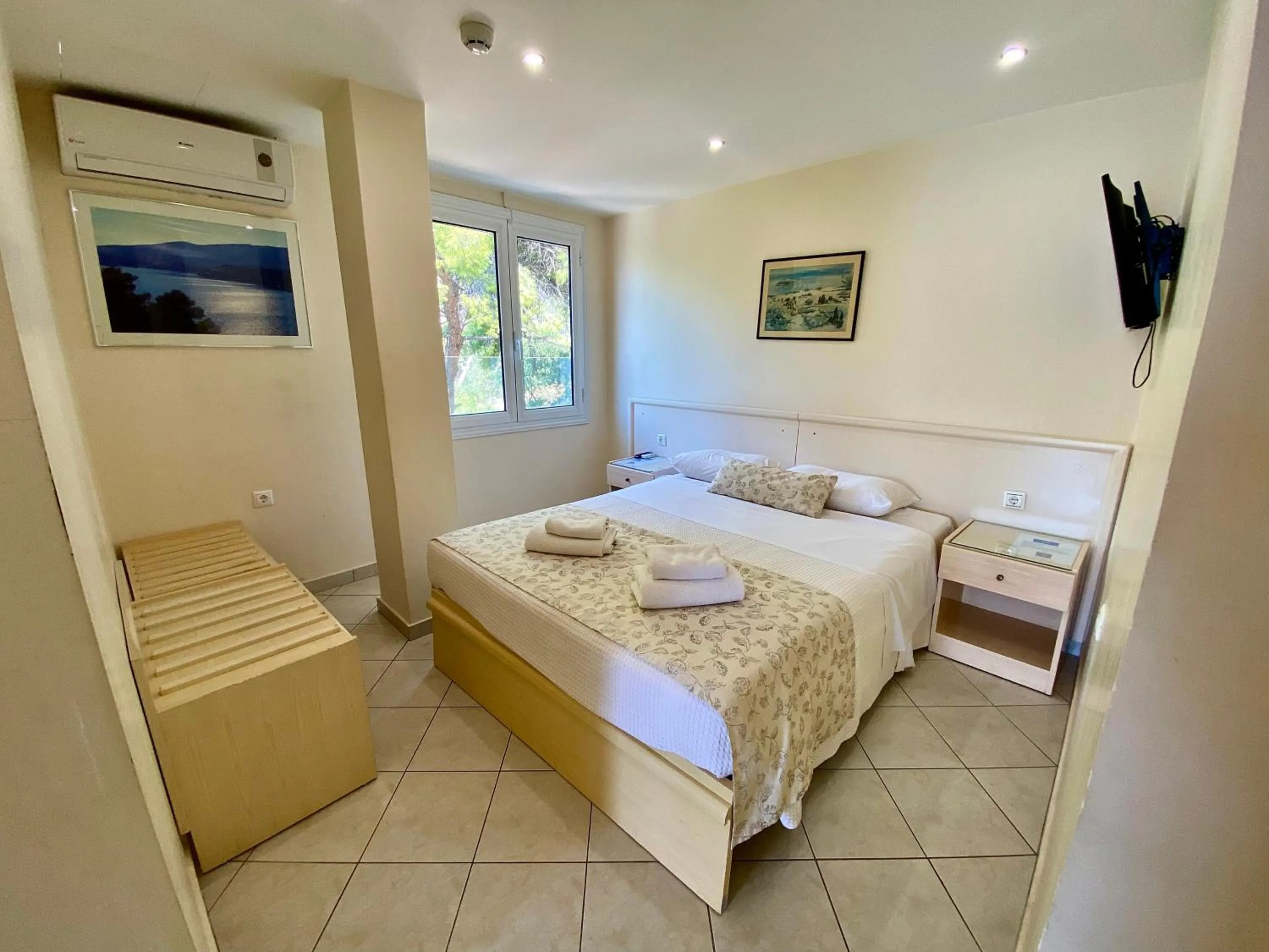 Bed in New Aegli Resort Hotel