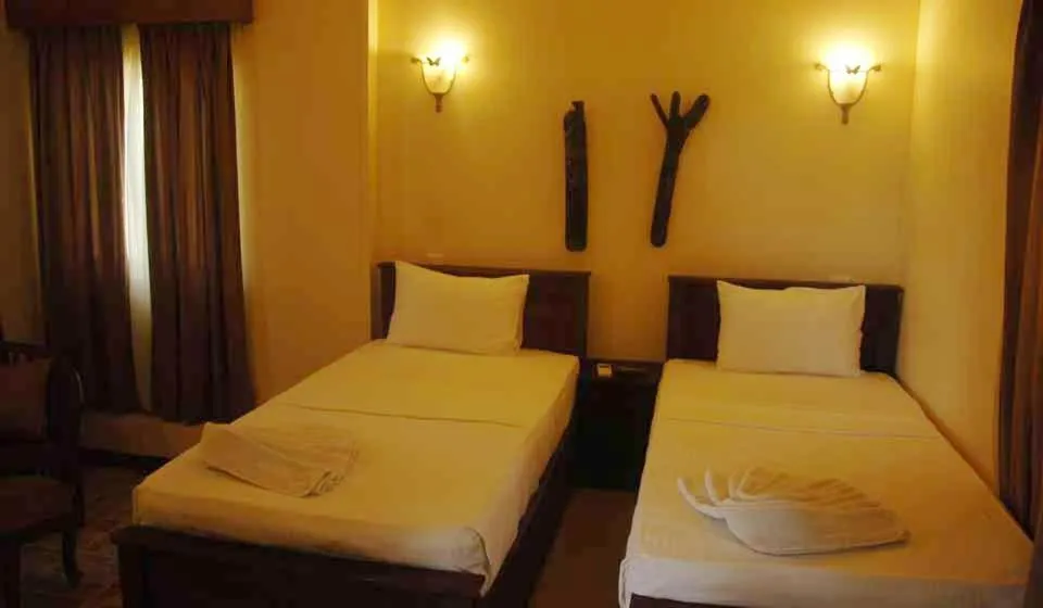 Bed in Vintara Eco Resort