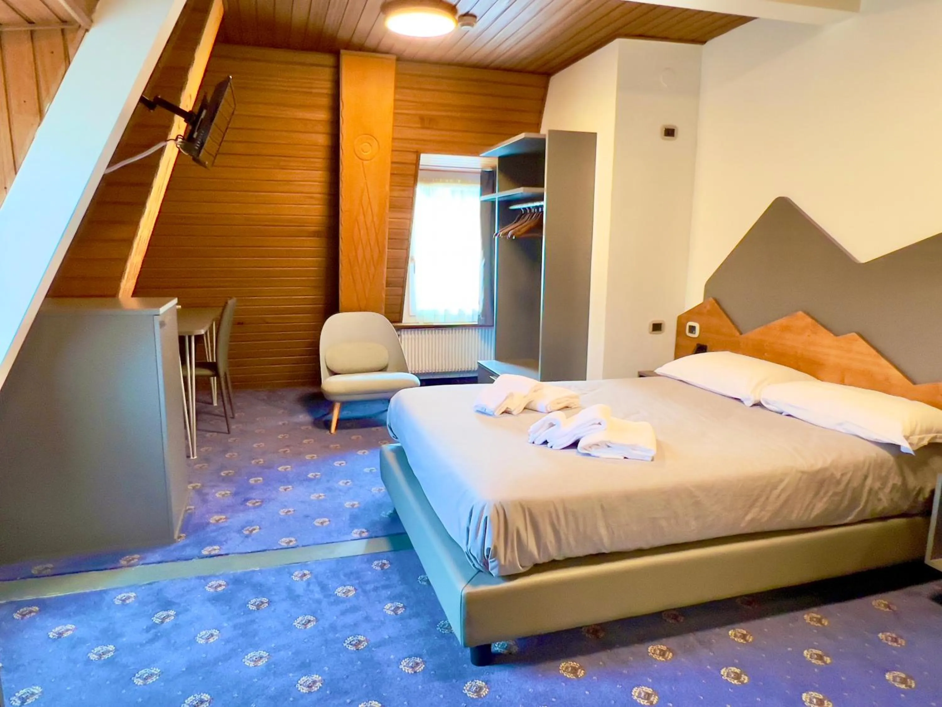 Bed in Hotel Regina del Bosco