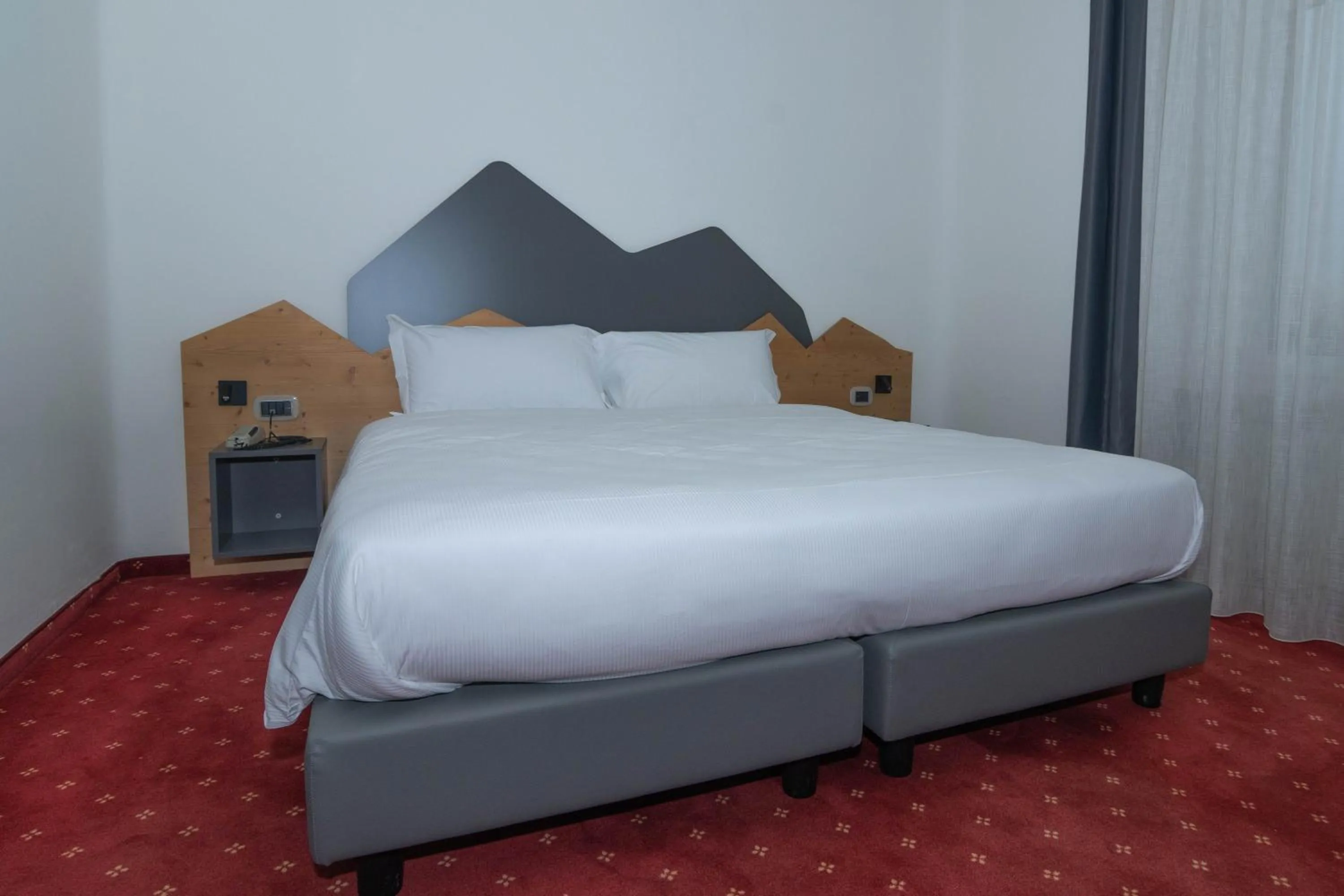 Bed in Hotel Regina del Bosco