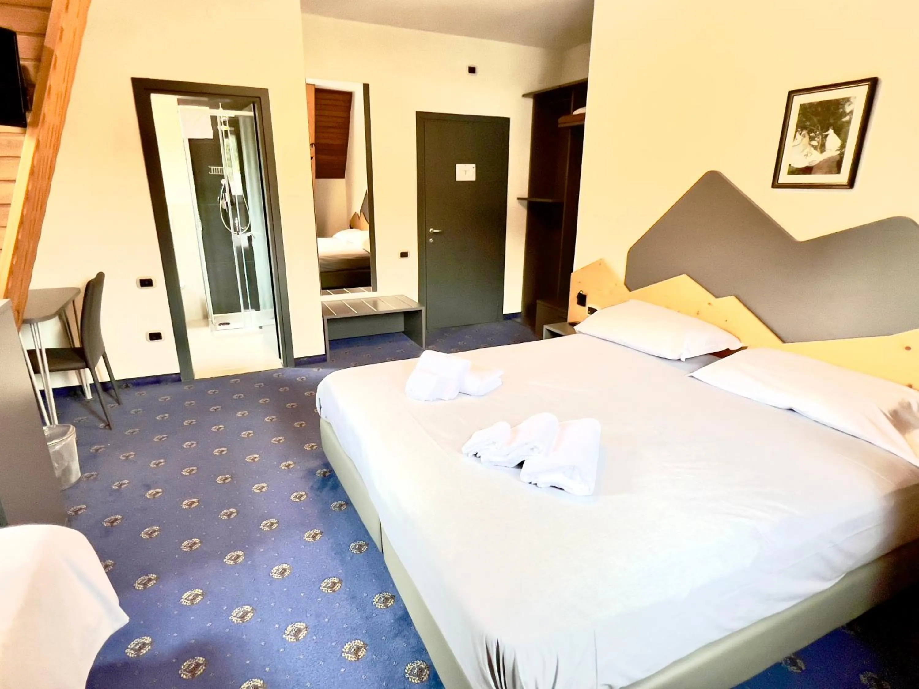 Bed in Hotel Regina del Bosco