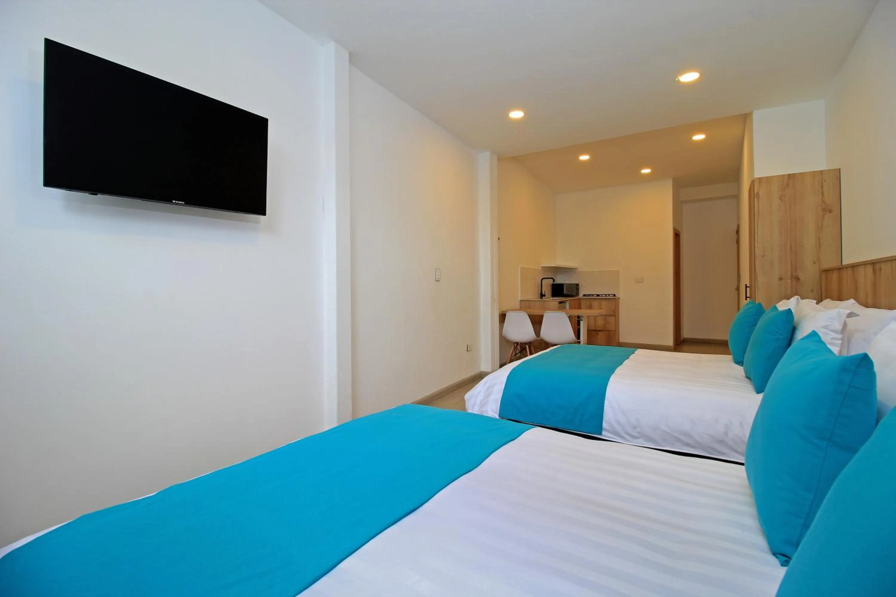 Bed in Apart Hotel Casa Blanca