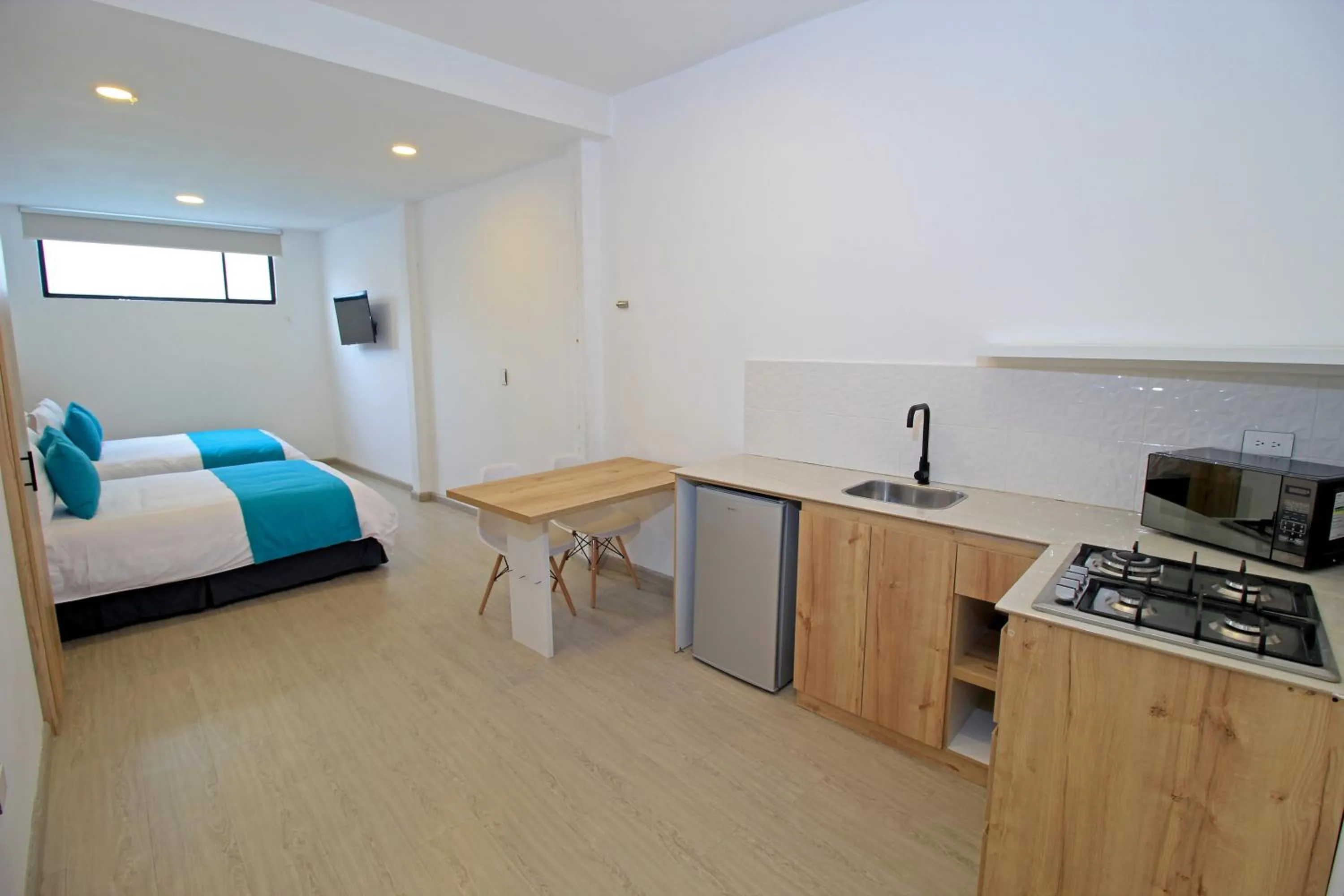 Bed in Apart Hotel Casa Blanca